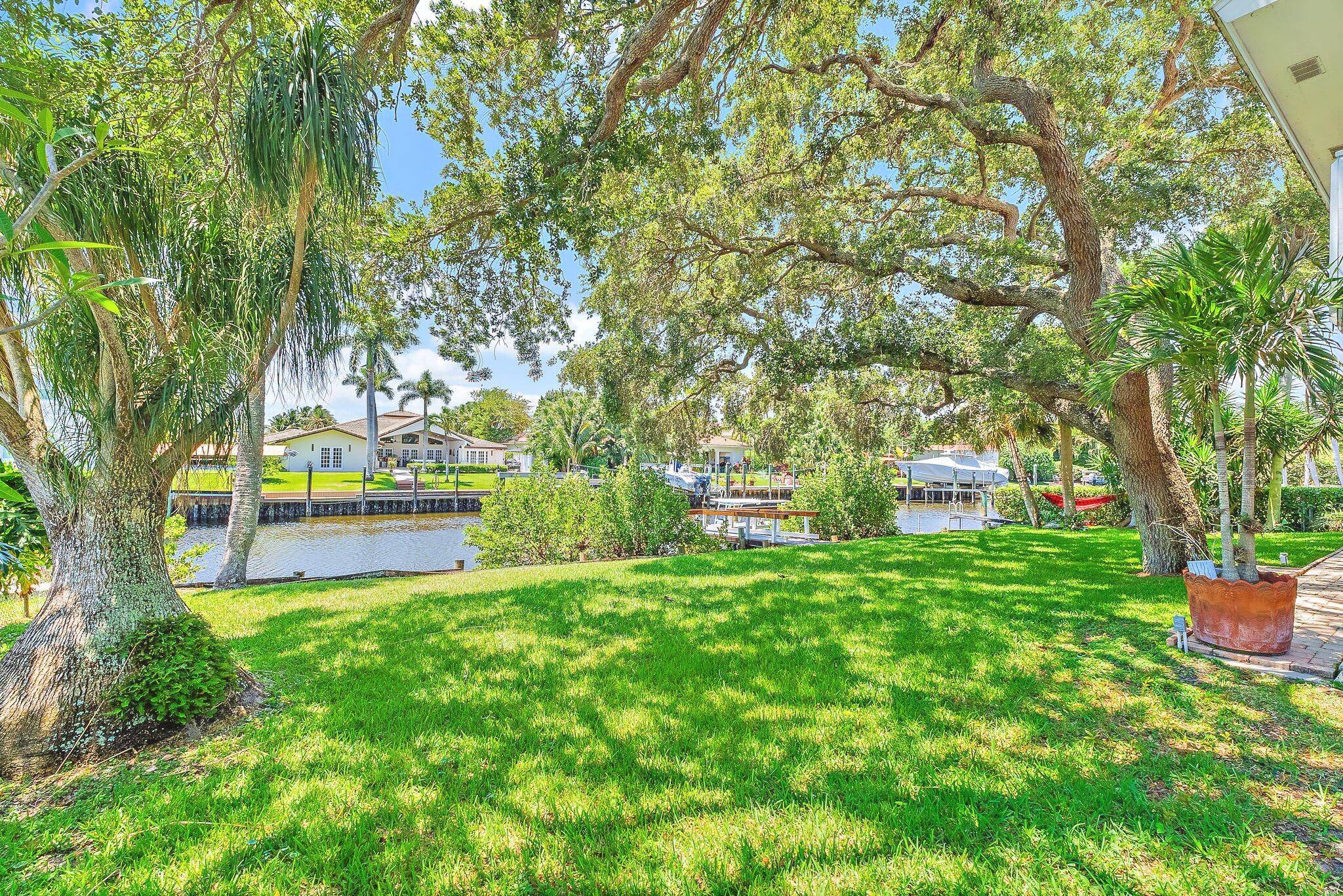 Nestled in Palm Beach Gardens, this Key West style residence is a serene waterfront retreat set on one of the largest deepwater lots in the area, spanning a rare and ...