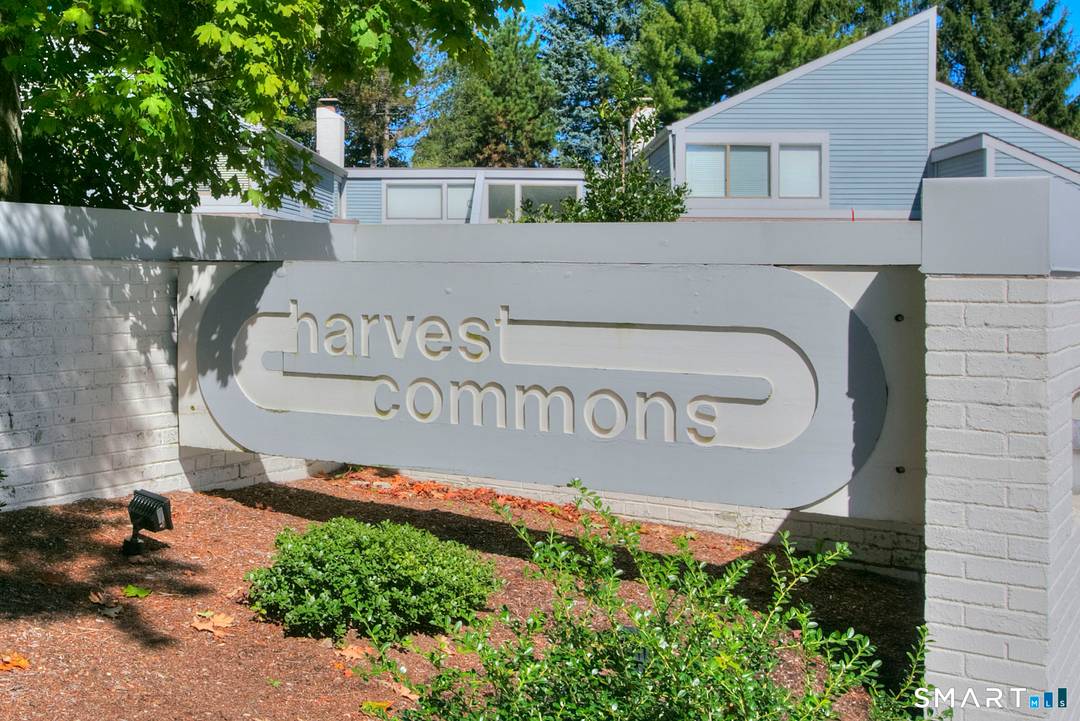Impeccably renovated one level 2 bed 2 bath ranch style condo in coveted Harvest Commons.