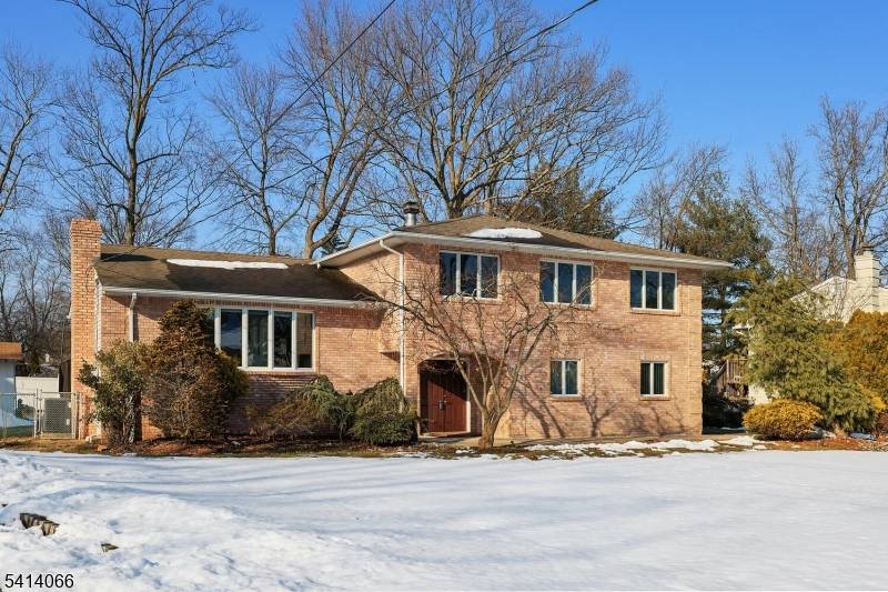 COMMUTERS DREAM EXCEPTIONAL CUSTOM BUILT SPLIT LEVEL HOME NESTLED ON A PREMIERE STREET IN CLARK TOWNSHIP WITH TOP RATED SCHOOLS.