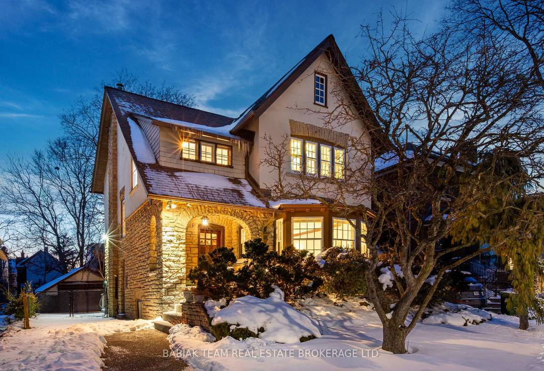 A rare offering of a beautiful stone amp ; stucco residence on one of Swansea's most sought after streets !