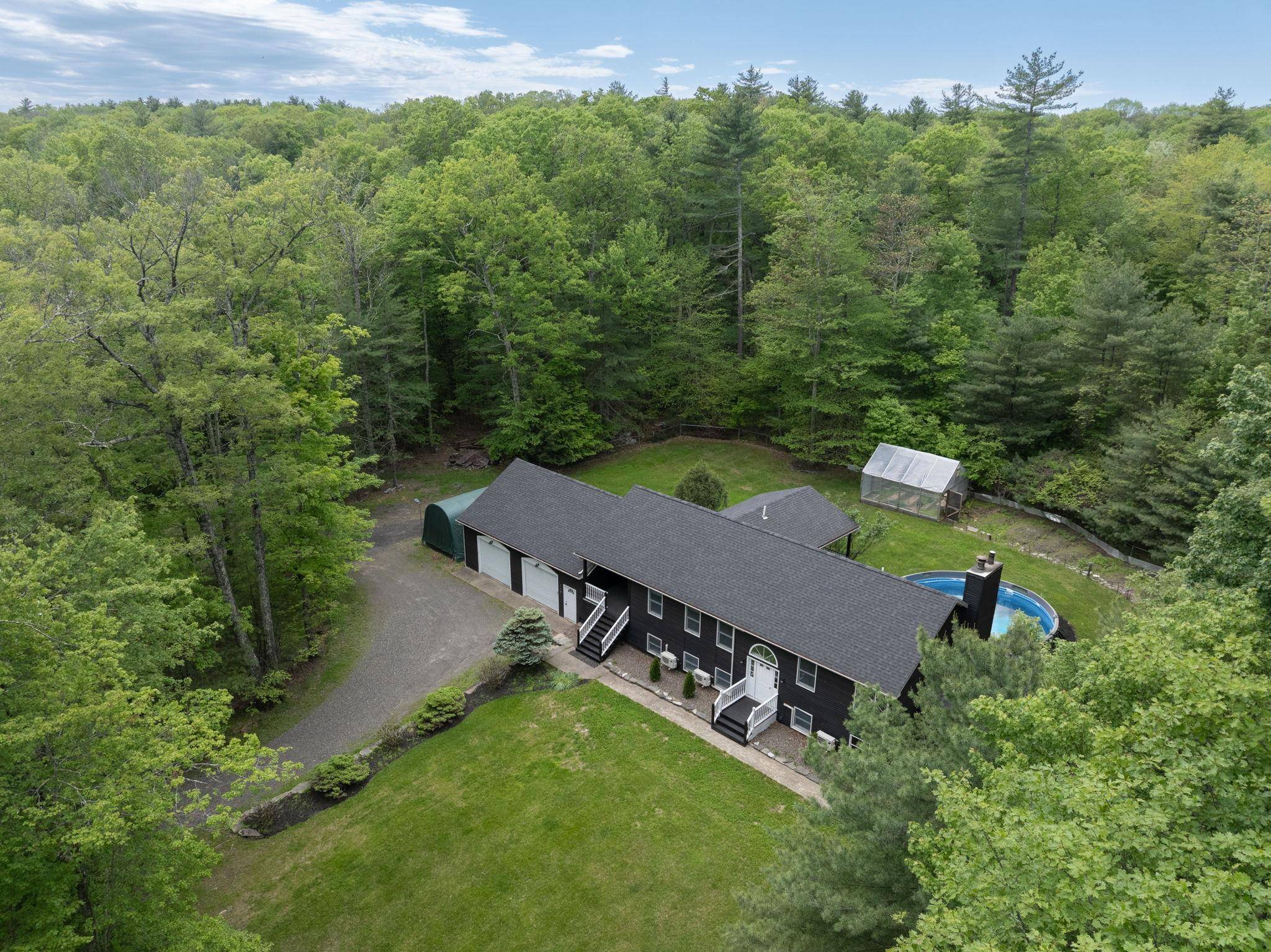 Nestled on a serene country road, this turnkey, beautifully maintained home offers exceptional comfort, privacy, diverse living spaces, and a host of modern updates ideal for relaxed living.