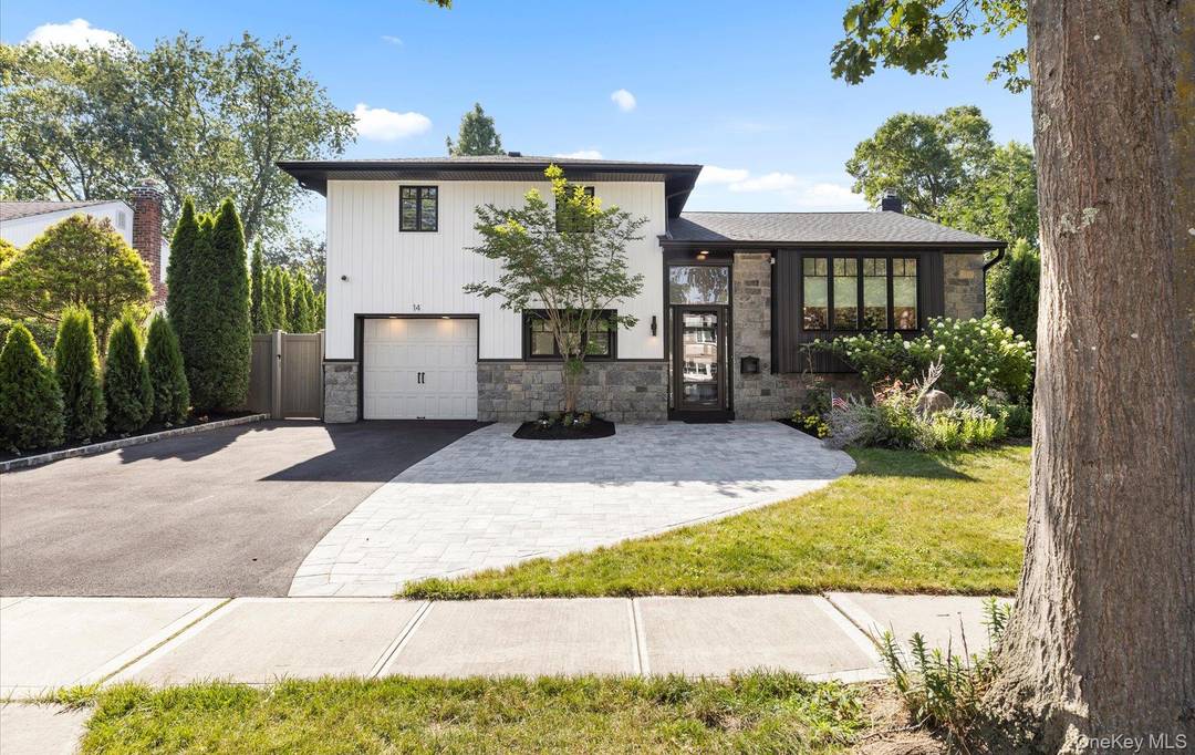 Welcome to 14 John Drive, this stunning amp ; updated expanded split level home features modern curb appeal, classic timeless style, new front granite exterior, walkway and driveway.