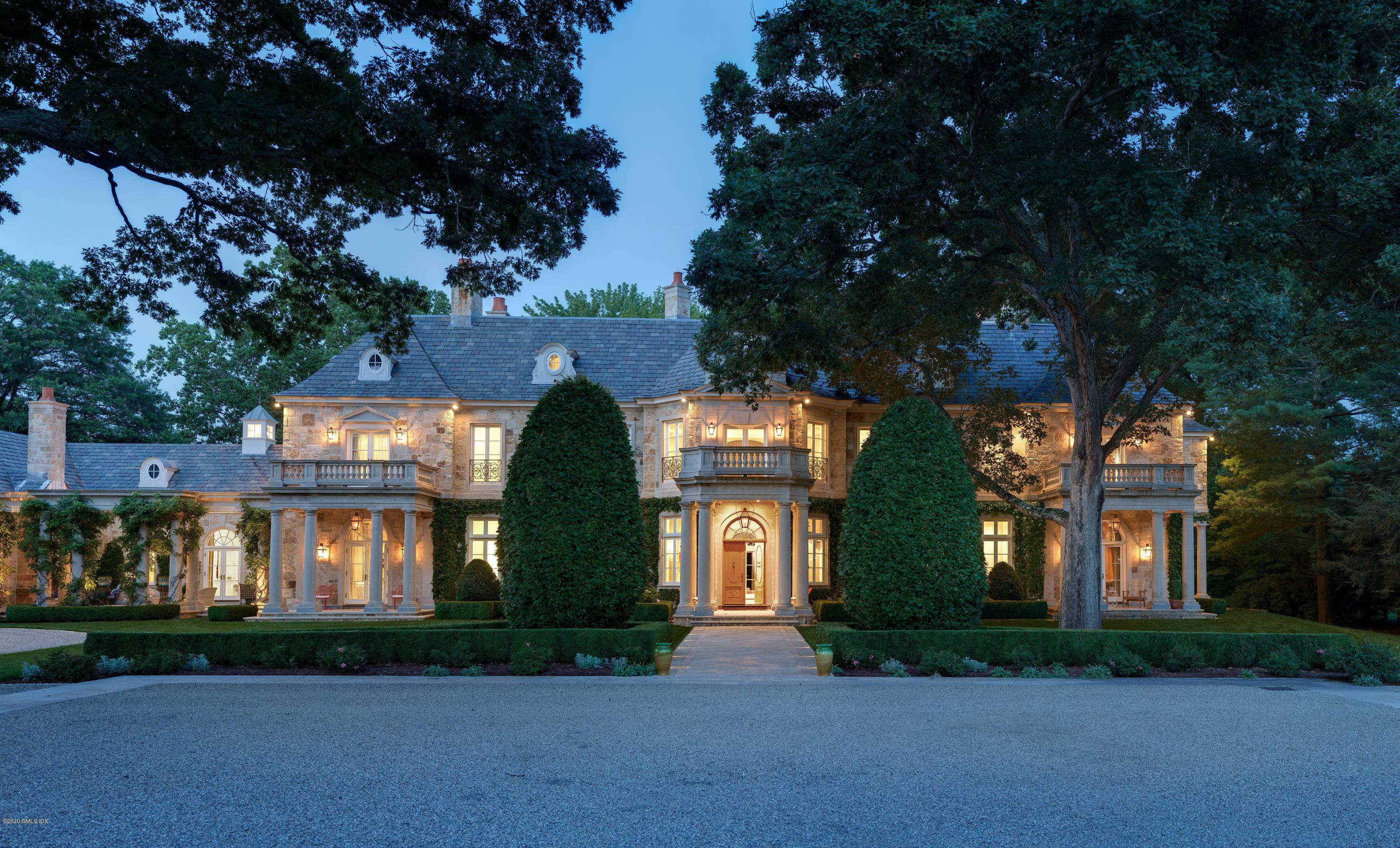 A French country estate, drawing from different periods of classical architecture, is prominently placed on a pristine 3 acre property offering verdant lawns, privacy and quick proximity to downtown Greenwich.