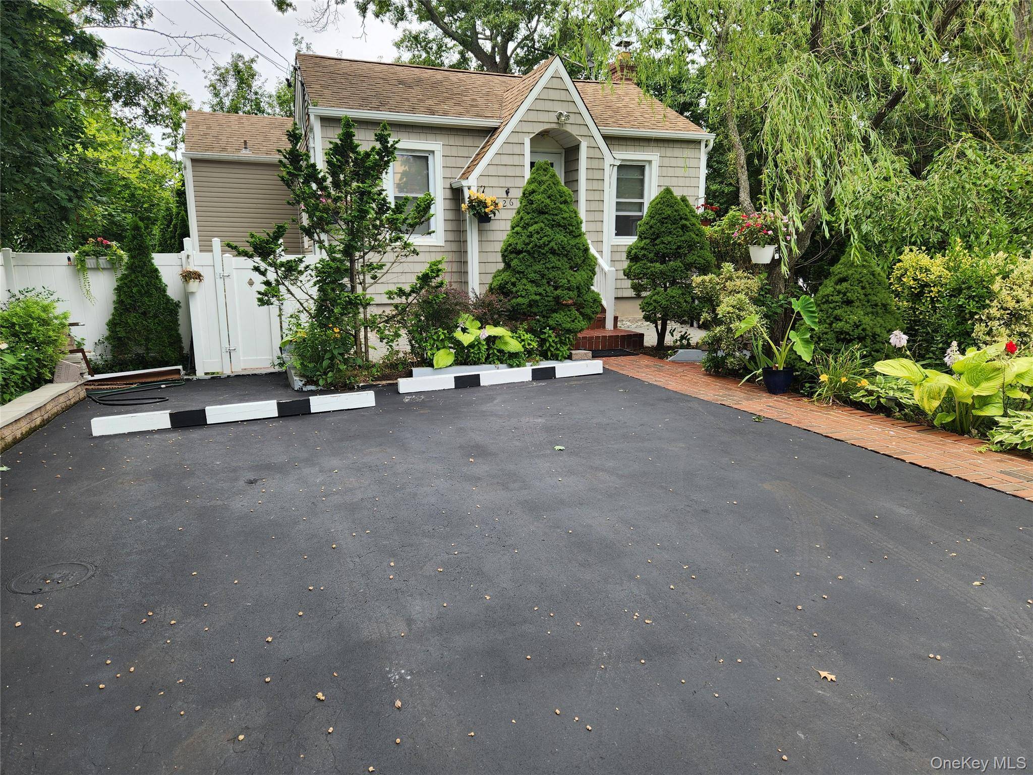 Charming Home Near Long Island Sound Discover your perfect coastal getaway with this beautifully updated home, nestled in a serene and private setting just minutes from the Long Island Sound.
