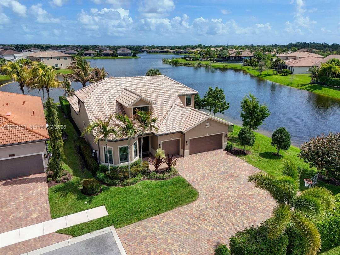 Experience breathtaking wraparound lakefront views from this exceptional 4 bedroom plus flex space, 4 bath Stonewater model home, ideally located on a quiet cul de sac within the highly sought ...