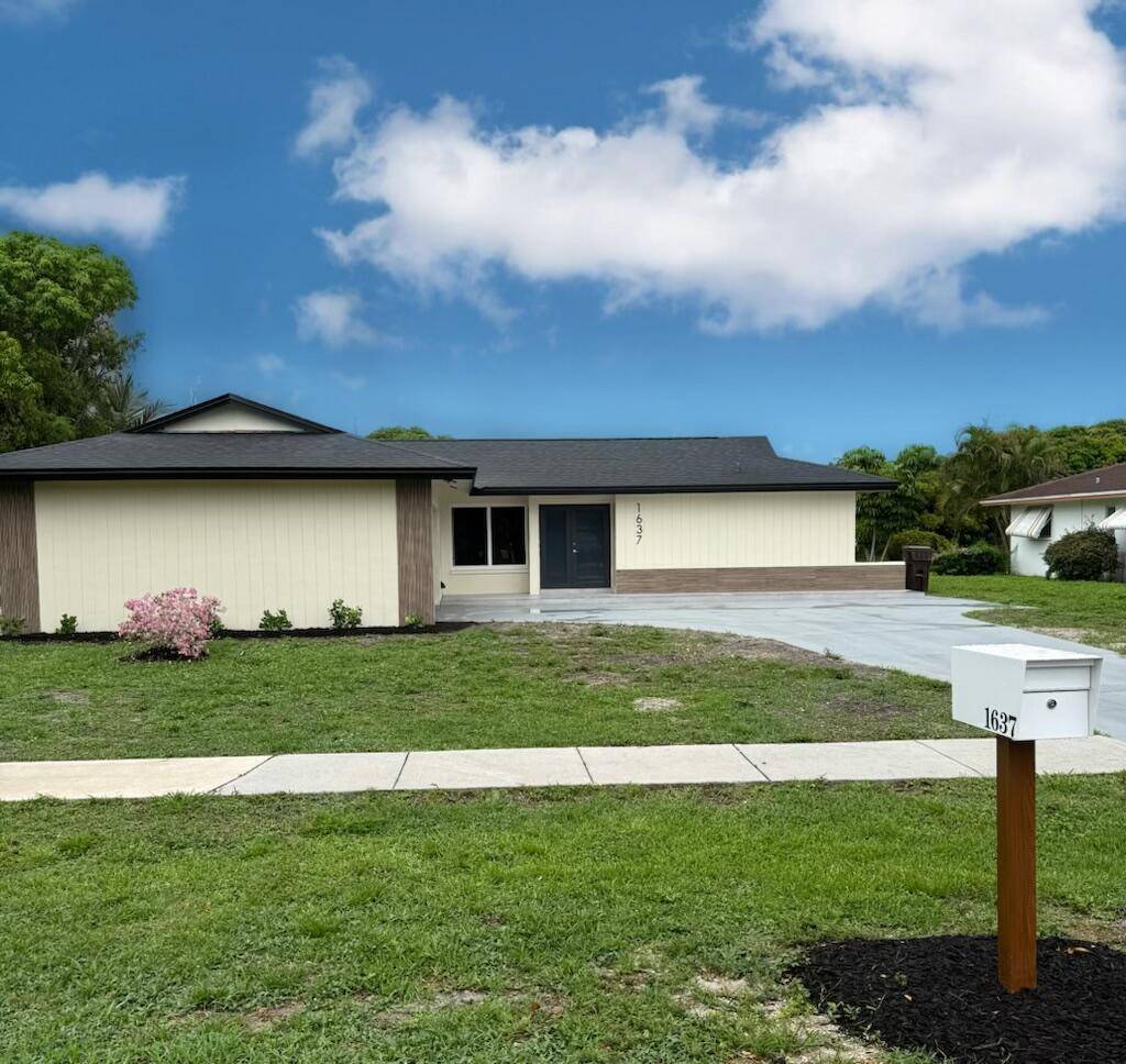 Discover this hidden gem nestled in West Palm Beach with NO HOA and scenic Lake Mangonia views.