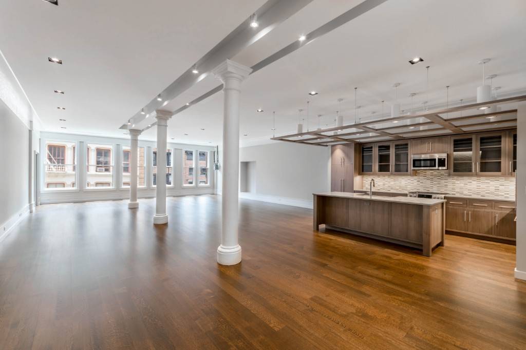 Come home to this 40 wide renovated artists loft with downtown authenticity in the center of prime Soho.