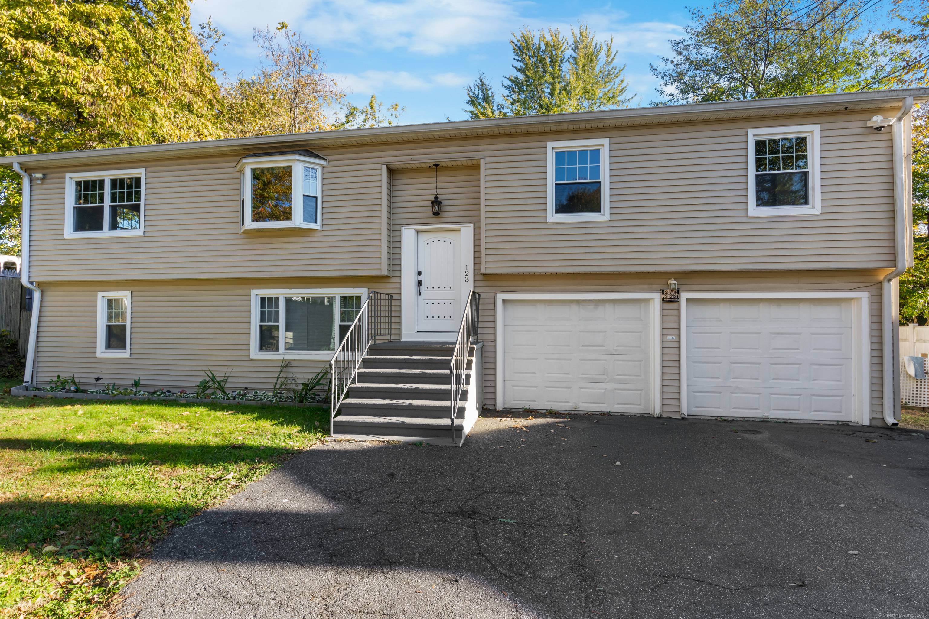 This spacious home features 4 bedrooms, 3 full bathrooms, central air, a two car garage, and a generous backyard.