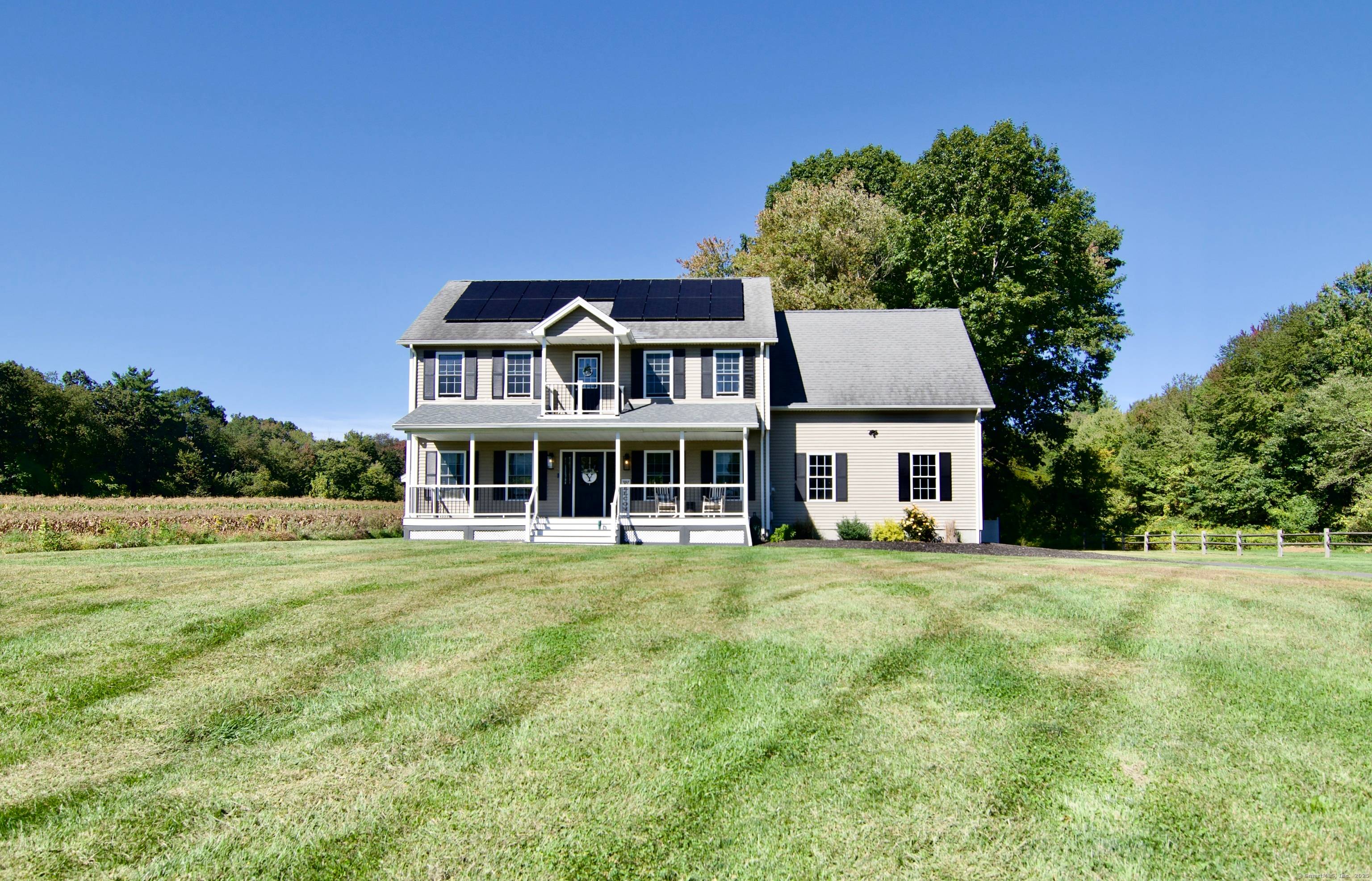 a beautifully maintained Colonial set on nearly 2 private acres in a desirable North Somers location.