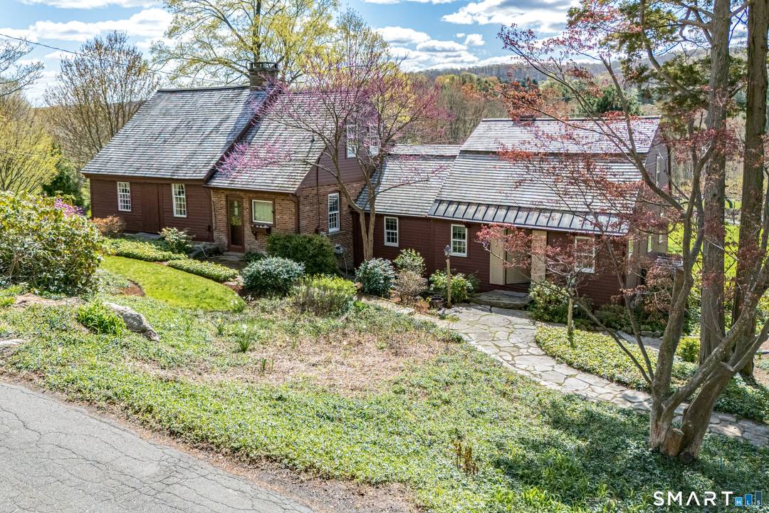 Nestled on 7. 5 picturesque acres in Higganum, 29 Spencer Road is a truly exceptional country property that seamlessly blends historic character with refined rural beauty.
