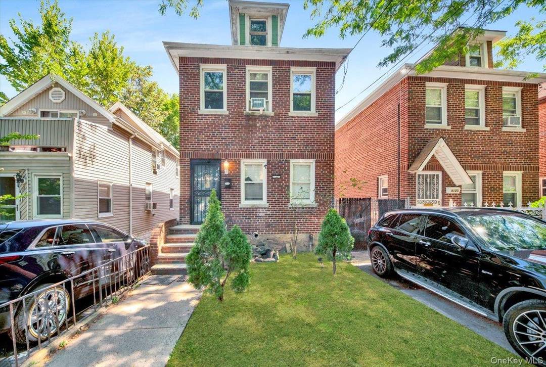 Wakefield Brick detached single family 3 bedroom duplex with living room, dinning room, Kitchen 2 full bath with finished basement and garage.