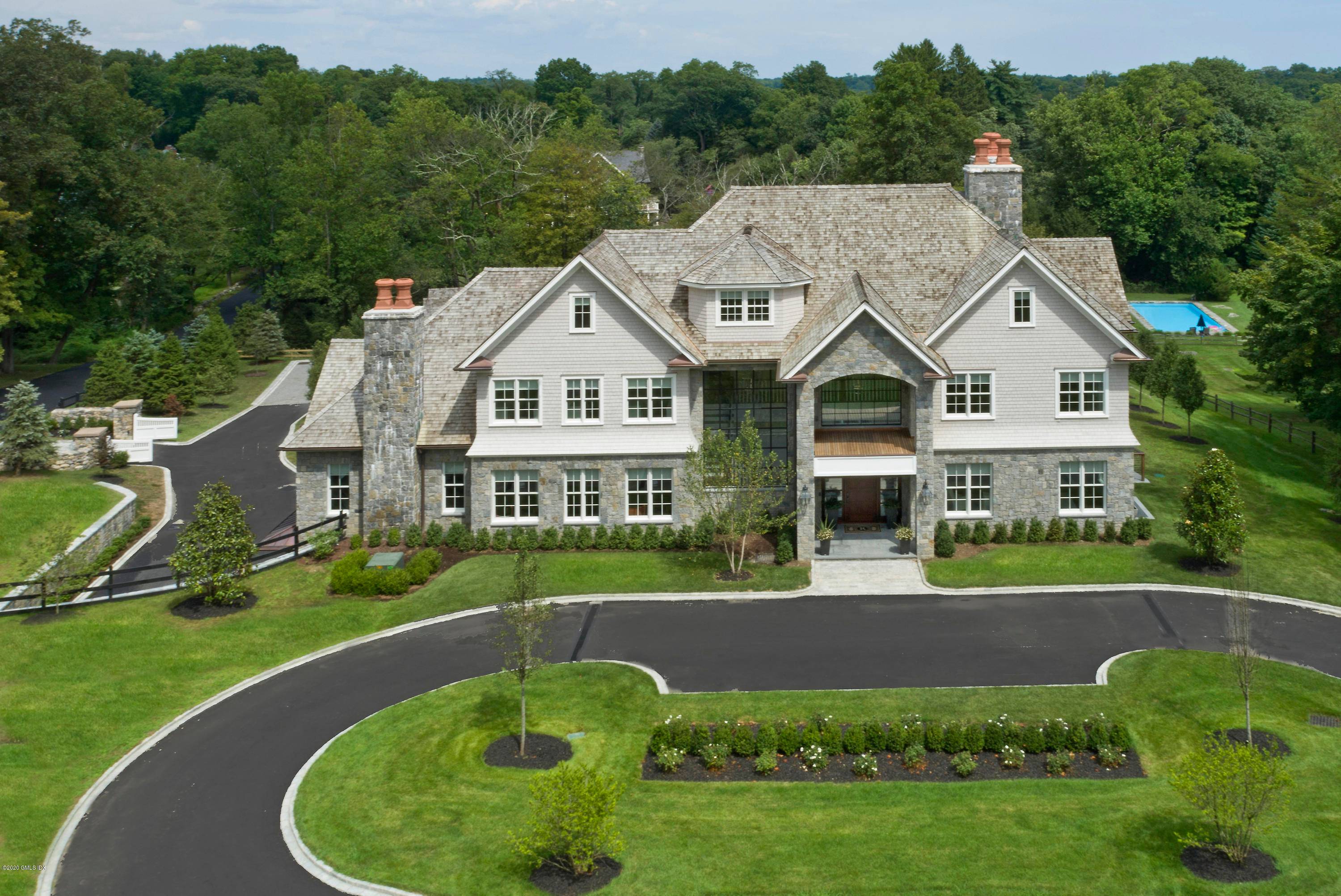 Spectacular, newly constructed14, 000sf estate sited on 2 1 2 acres includes a 2, 300sf heated and air conditioned barn, a 20ft x 40ft pool with infinity edge spa and ...