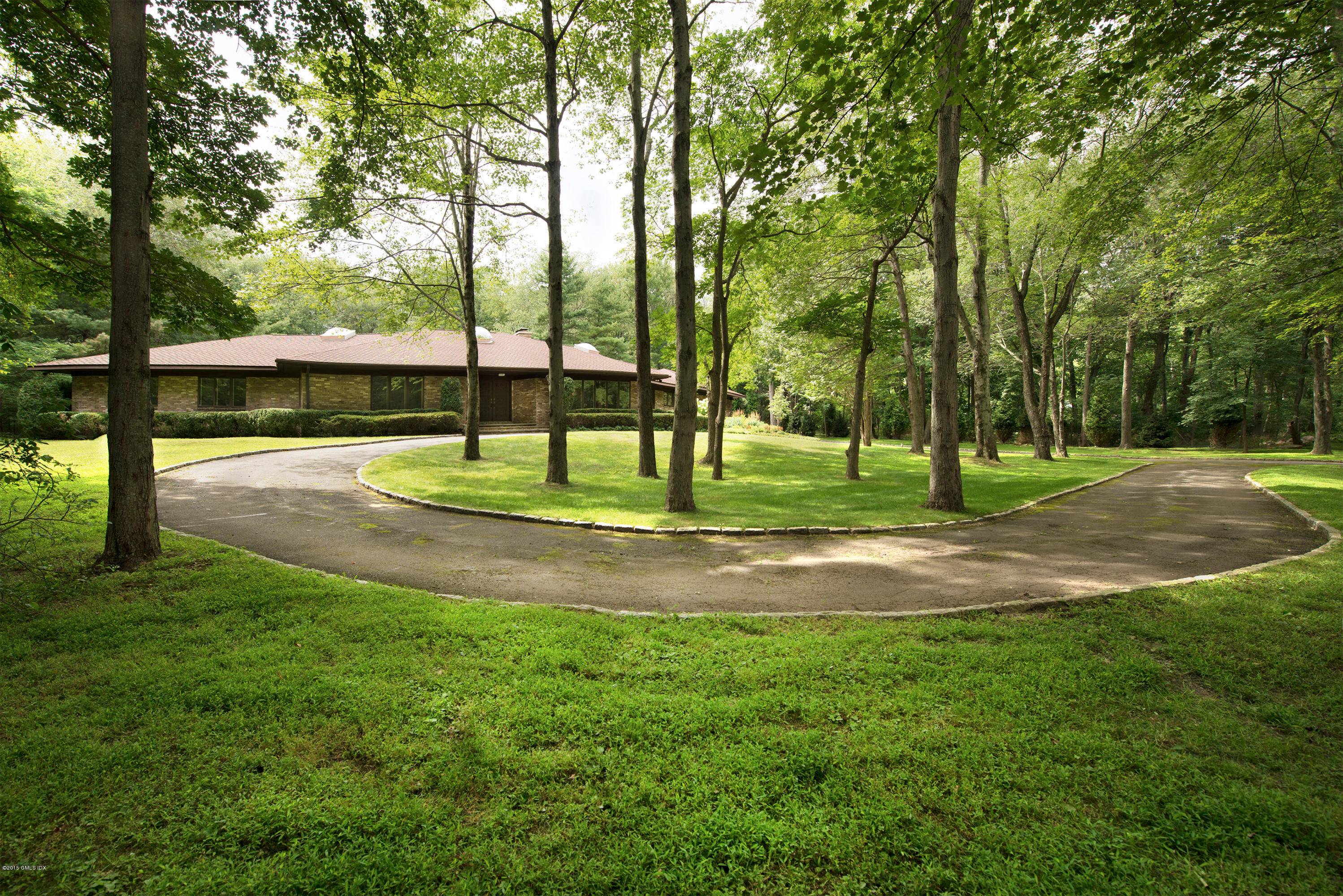CUSTOM BRICK RANCH FEATURING SPACIOUS ONE FLOOR LIVING, HARDWOOD FLOORS THROUGHOUT, AND EXCELLENT CURB APPEAL.