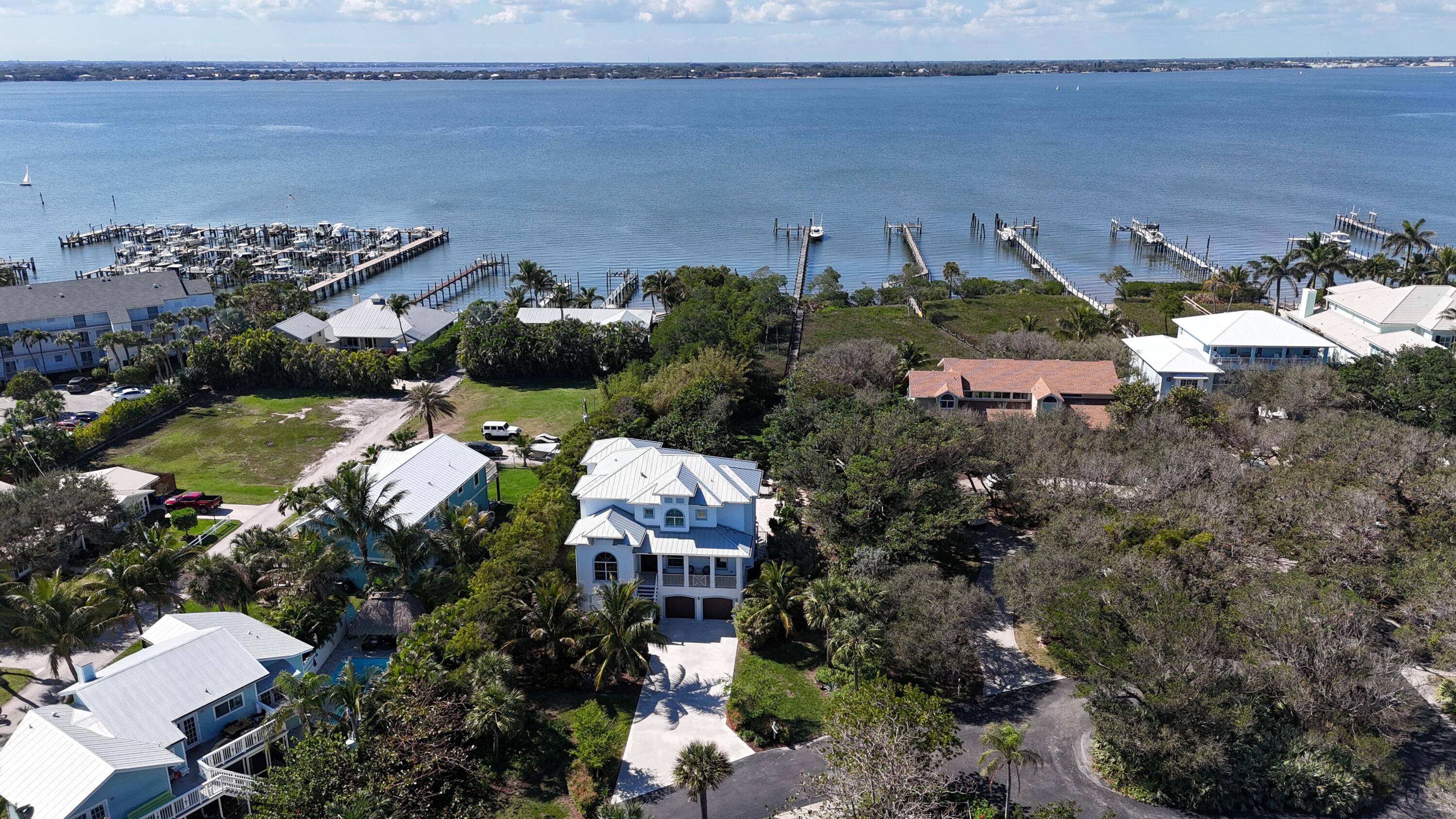 Welcome to 1702 NE Ocean Blvd, a breathtaking waterfront masterpiece in the prestigious Buttonwood neighborhood.