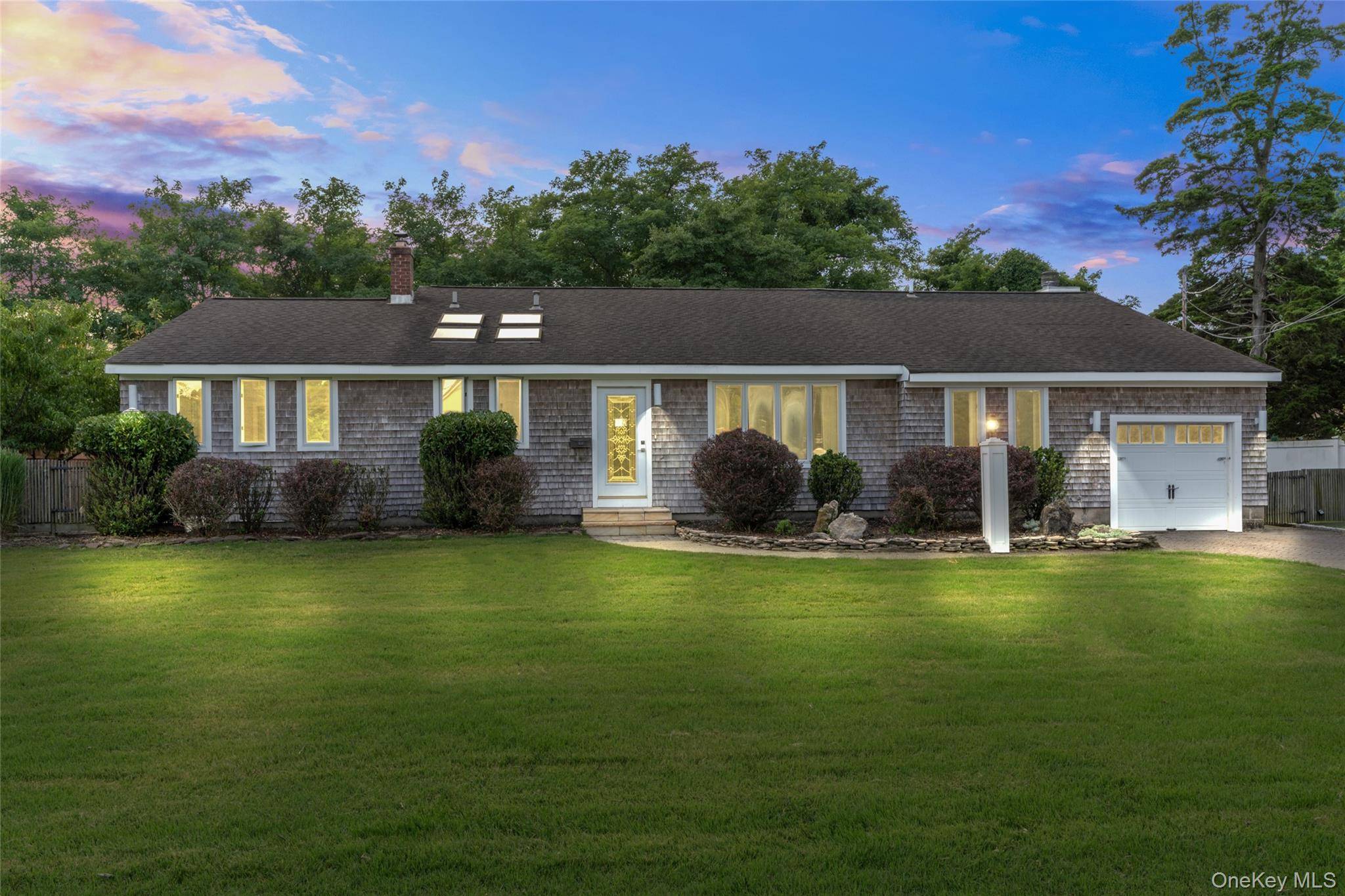 Welcome to 324 Durkee Ln, East Patchogue a beautifully maintained 3 bedroom, 2 bathroom home nestled on flat land just a minute walk from the private beach.