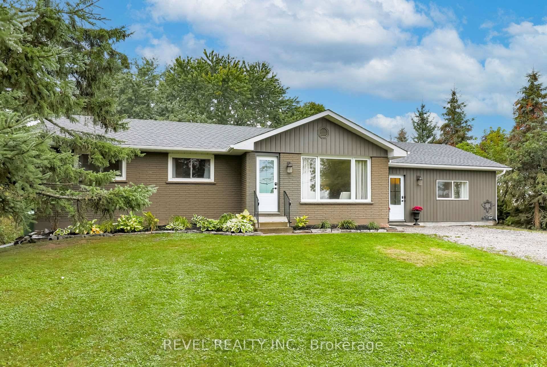This beautiful and spacious bungalow is ideally situated just minutes from Lindsay, nestled on a large country lot.