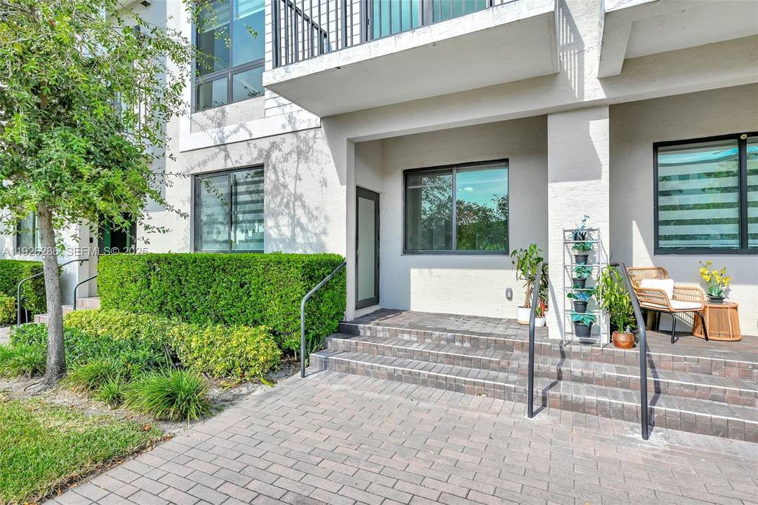 Located in the prestigious Downtown Doral, this stunning ground level 4 bedroom, 3 bath Model MI condo offers 1, 509 sq.