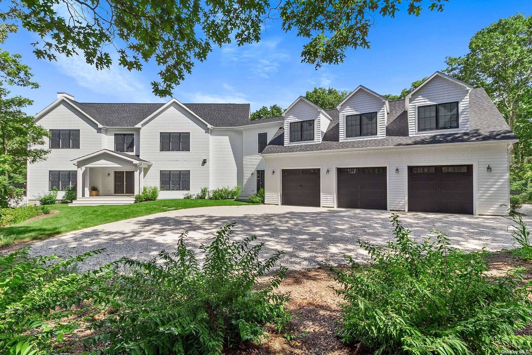 Down a long driveway you find this wonderful compound in Water Mill consisting of a beautiful newly constructed main house, separate guest cottage and a separate pool house.