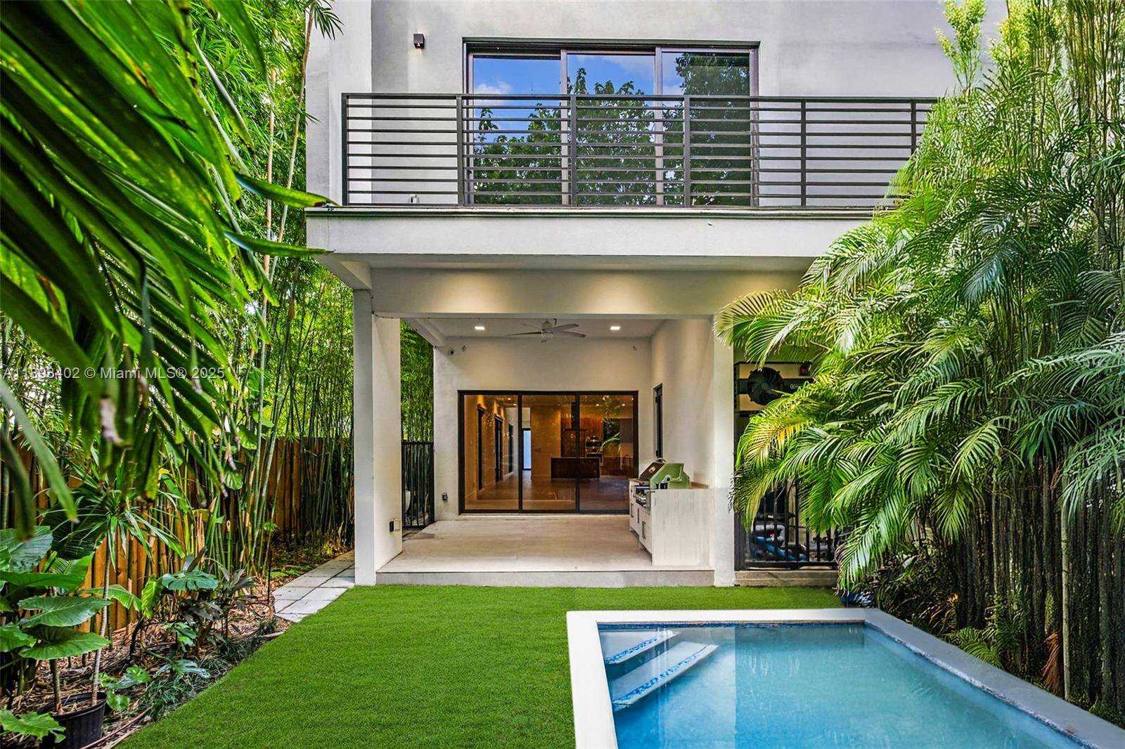 Experience the best of Coconut Grove living in this modern 4 bedroom, 5 bath luxury single family home, built in 2022 for effortless indoor outdoor living.