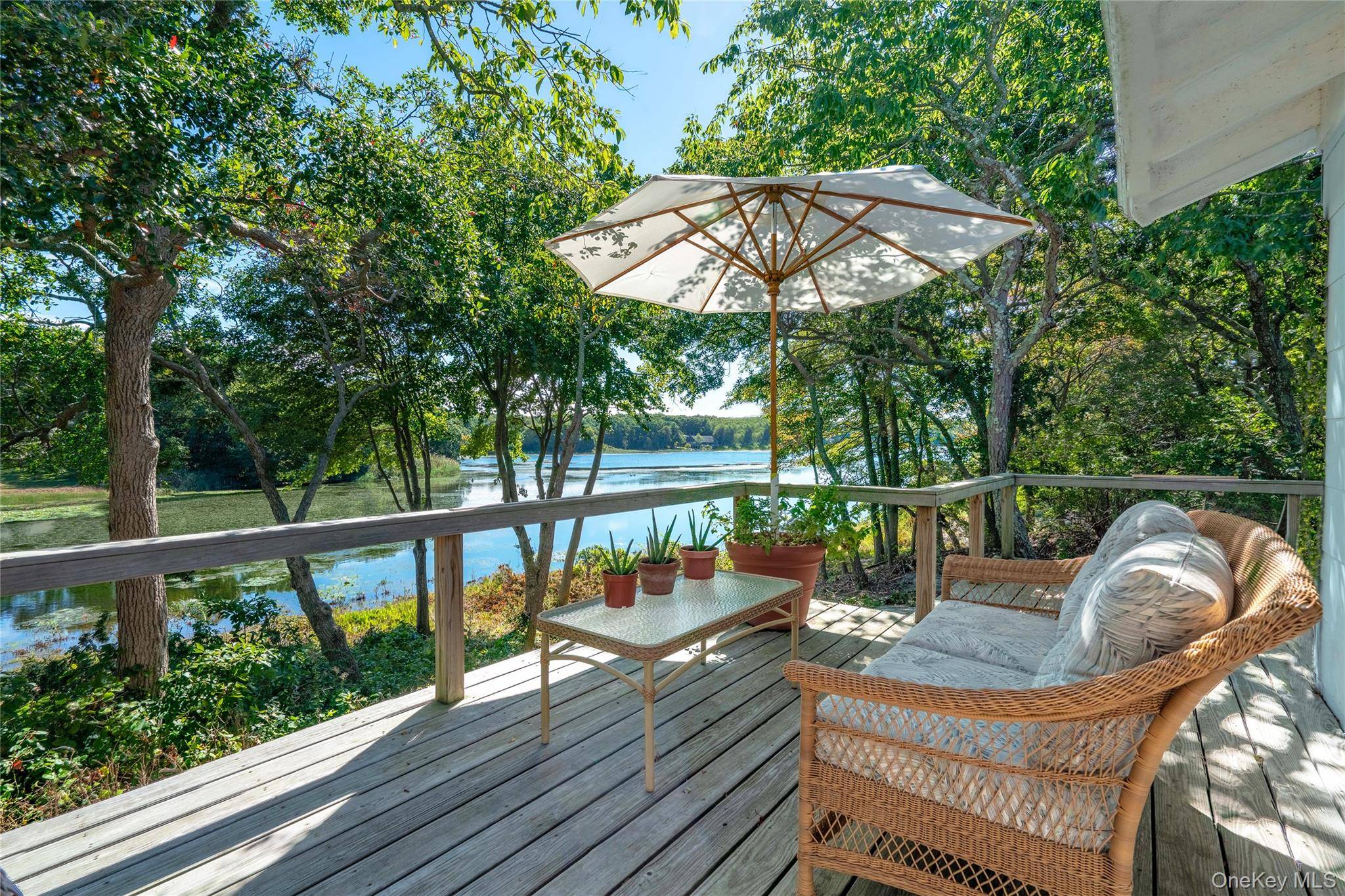 Rental Permit 0966 Fantastic home set directly on Great Pond and a block 975 feet from Kenney's Beach with restaurant Little Fish just around the corner.