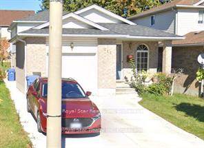 Welcome to 212 Country Club Dr, A charming 3 bedroom detached house features an open concept living and kitchen area with quartz counter top, perfect for modern living.