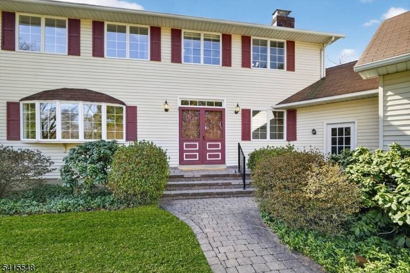 This welcoming 5 Bedroom home sits at the end of a quiet cul de sac on a private 1.