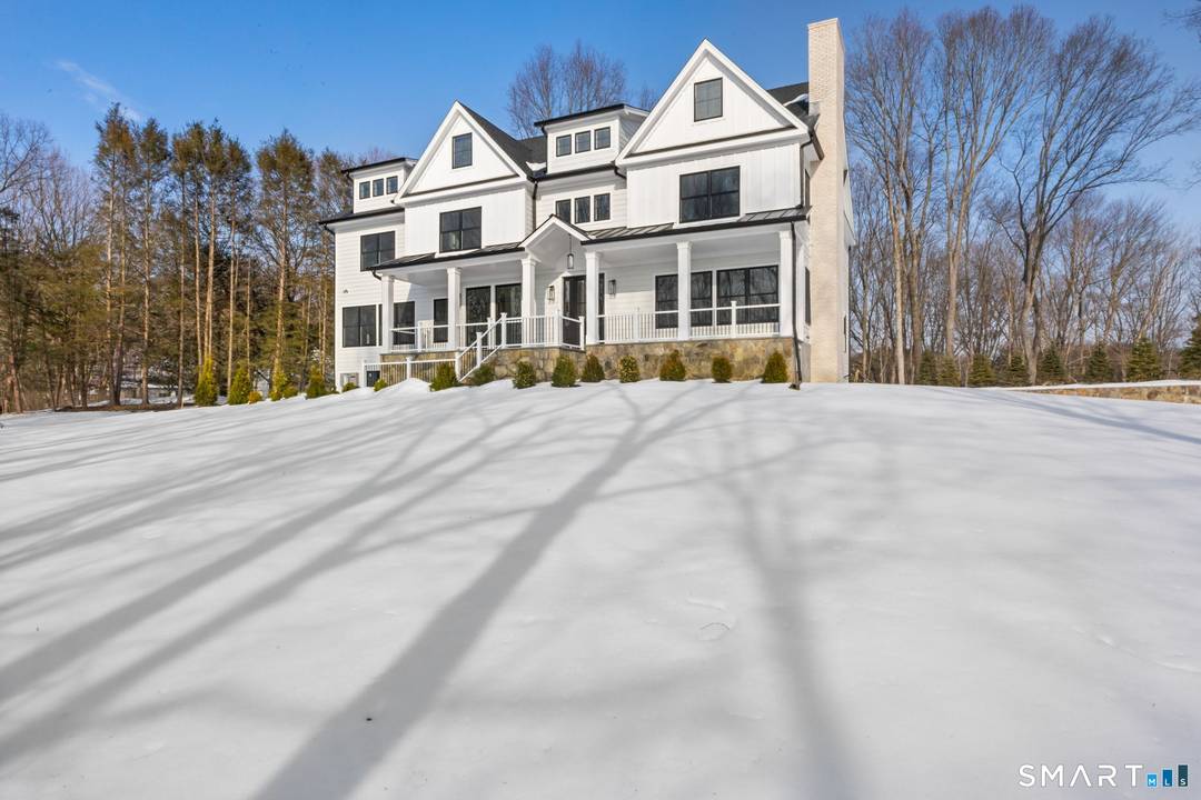 Welcome to 150 Wildwood Road, an exceptional new construction residence that perfectly blends timeless colonial architecture with modern sophistication.