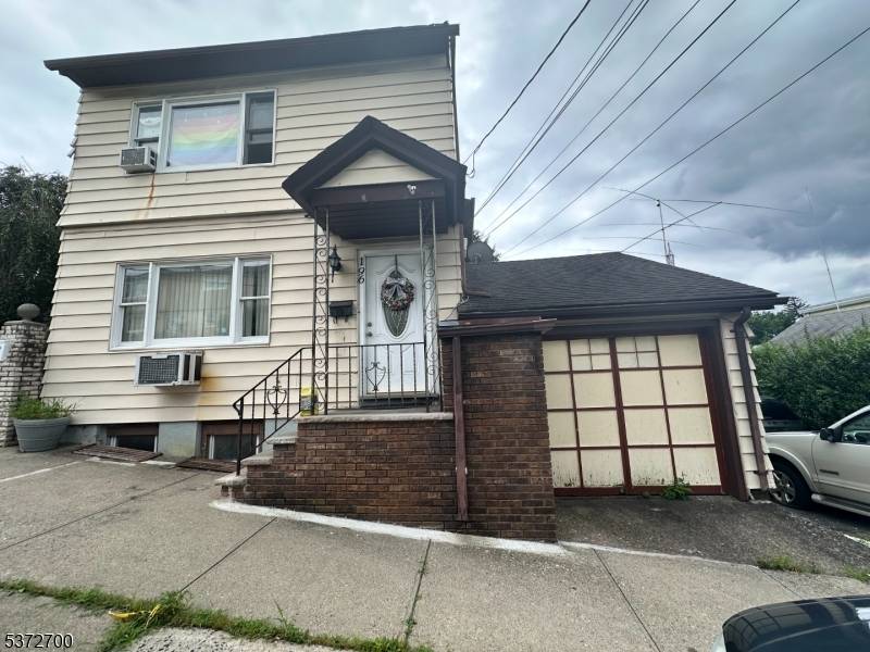 Sitting on a generous 75 x 100 lot, this versatile home offers 2 bedrooms on the first floor with potential for a third, living room, dining room and laundry room.