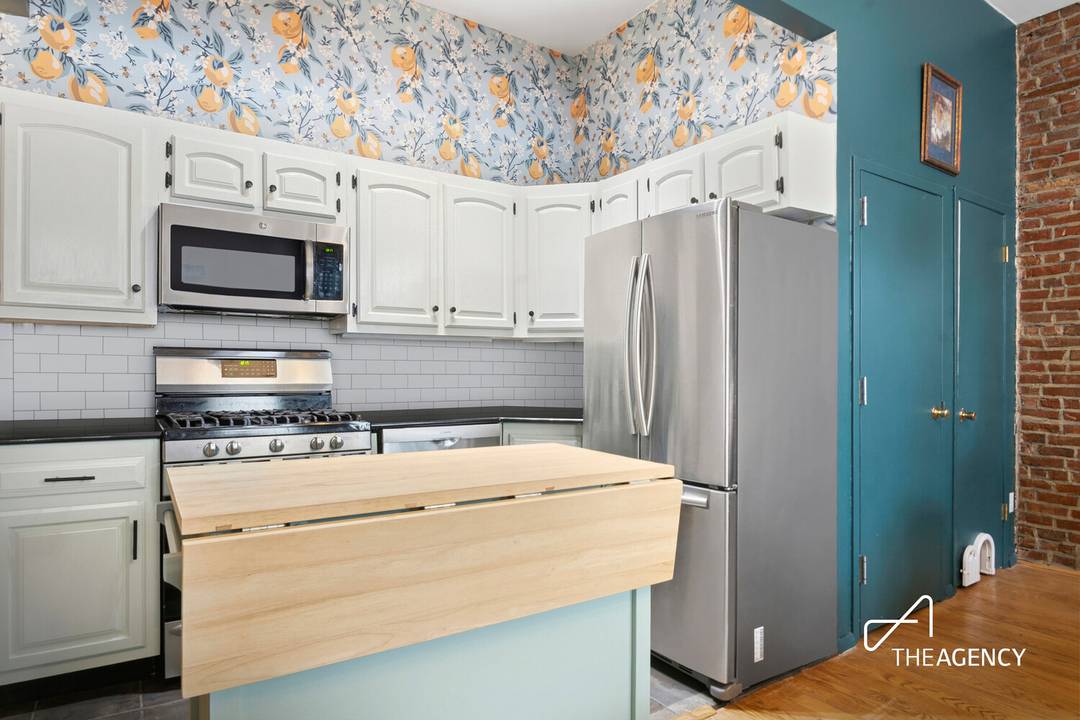 This approximately 1, 000 SF two bedroom, two bathroom condominium in North Park Slope combines historic charm with modern conveniences.