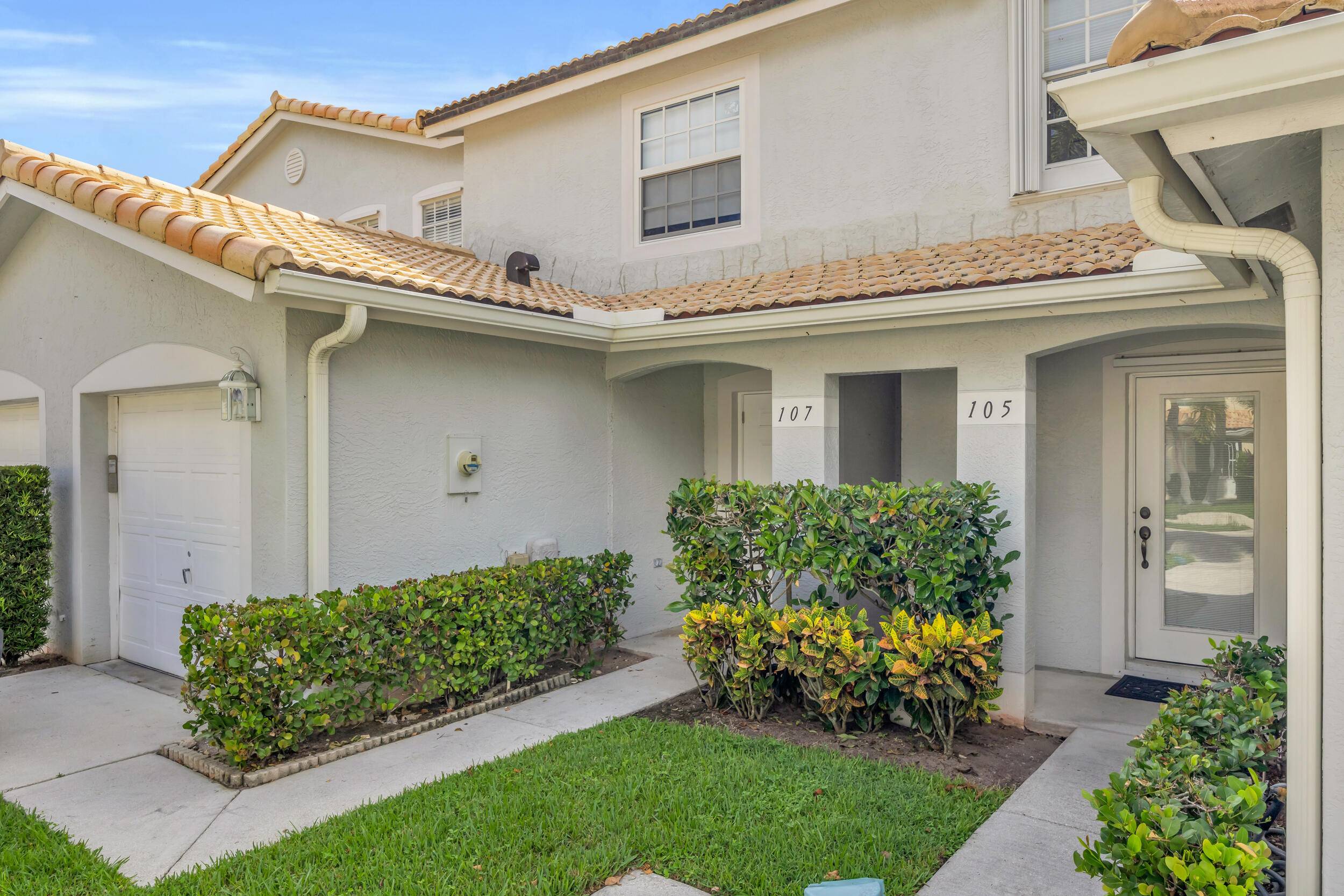 Welcome to 107 Wooden Mill Terrace, a beautifully reimagined two bedroom, two and a half bathroom townhome in the heart of Jupiter.