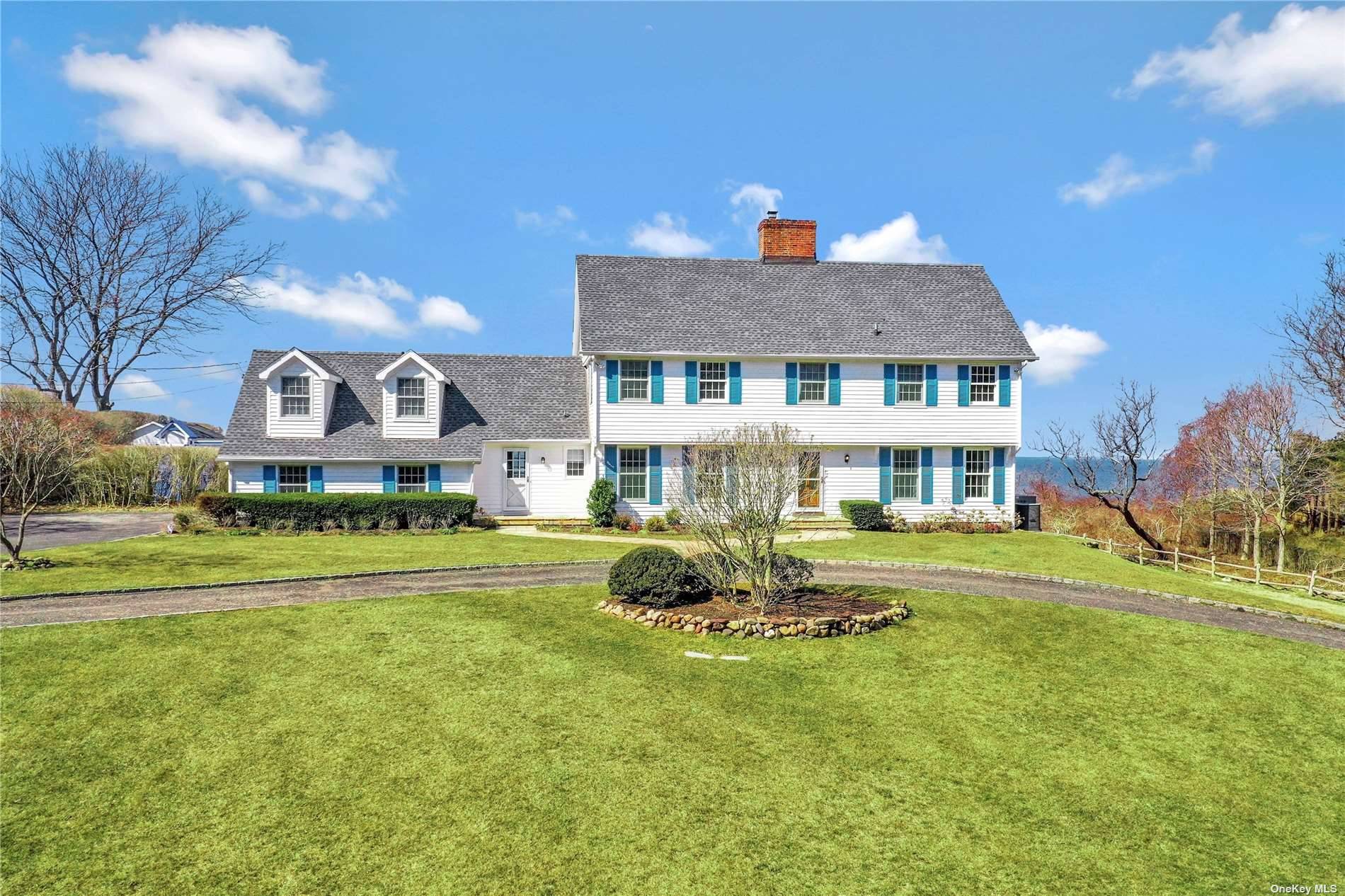 Perfect North Fork Soundfront retreat on 2 private acres with heated waterside pool.