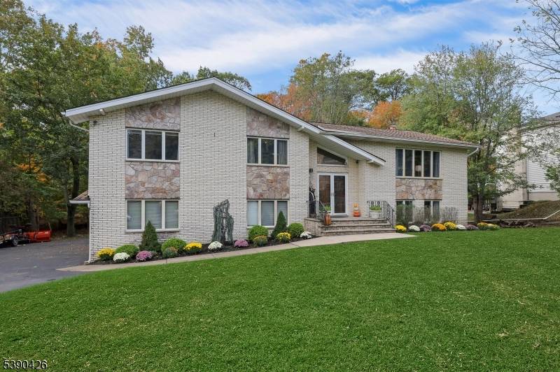 Sitting in a picturesque desirable neighborhood, this lovely brick and stone faced oversize bilevel home has amazing curb appeal and offers an ideal floor plan for daily enjoyment and entertaining.