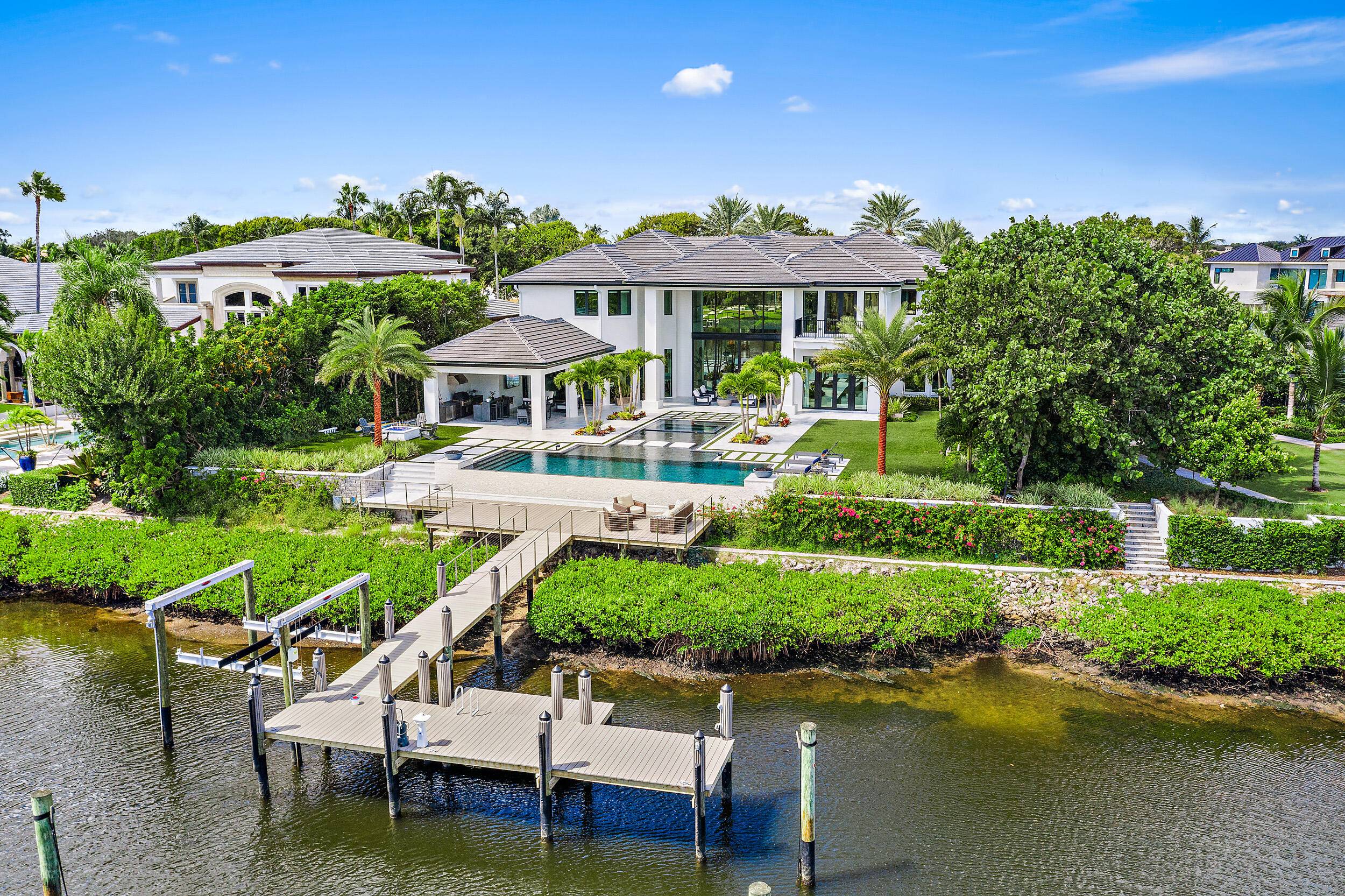 Modern sleek design with dramatic open spaces, soaring ceilings and water views from almost every room.