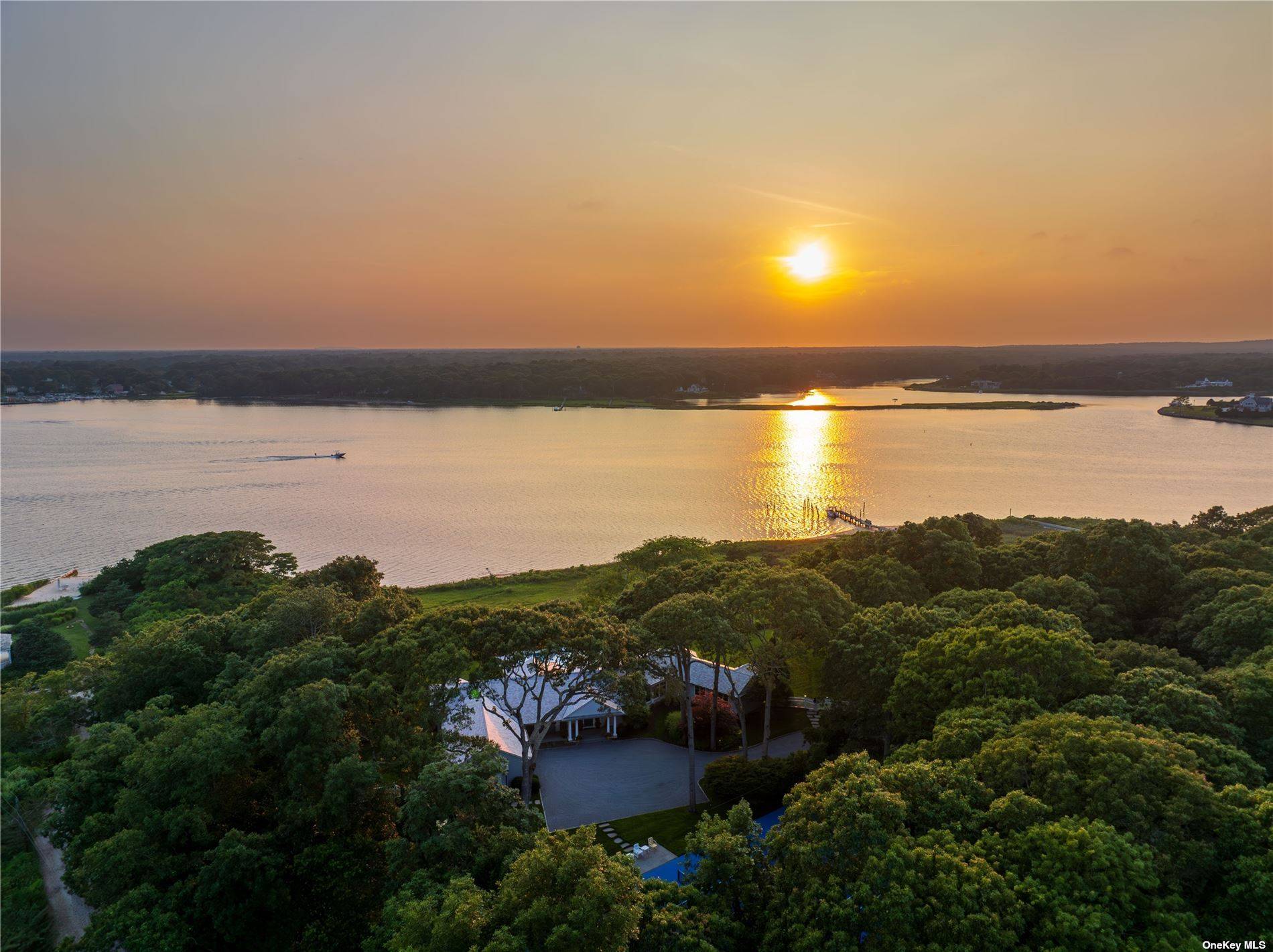 Magnificent west facing views of Seatuck Cove from this secluded property at the end of a cul de sac on the sought after Cedar Lane, with 386' of private water ...