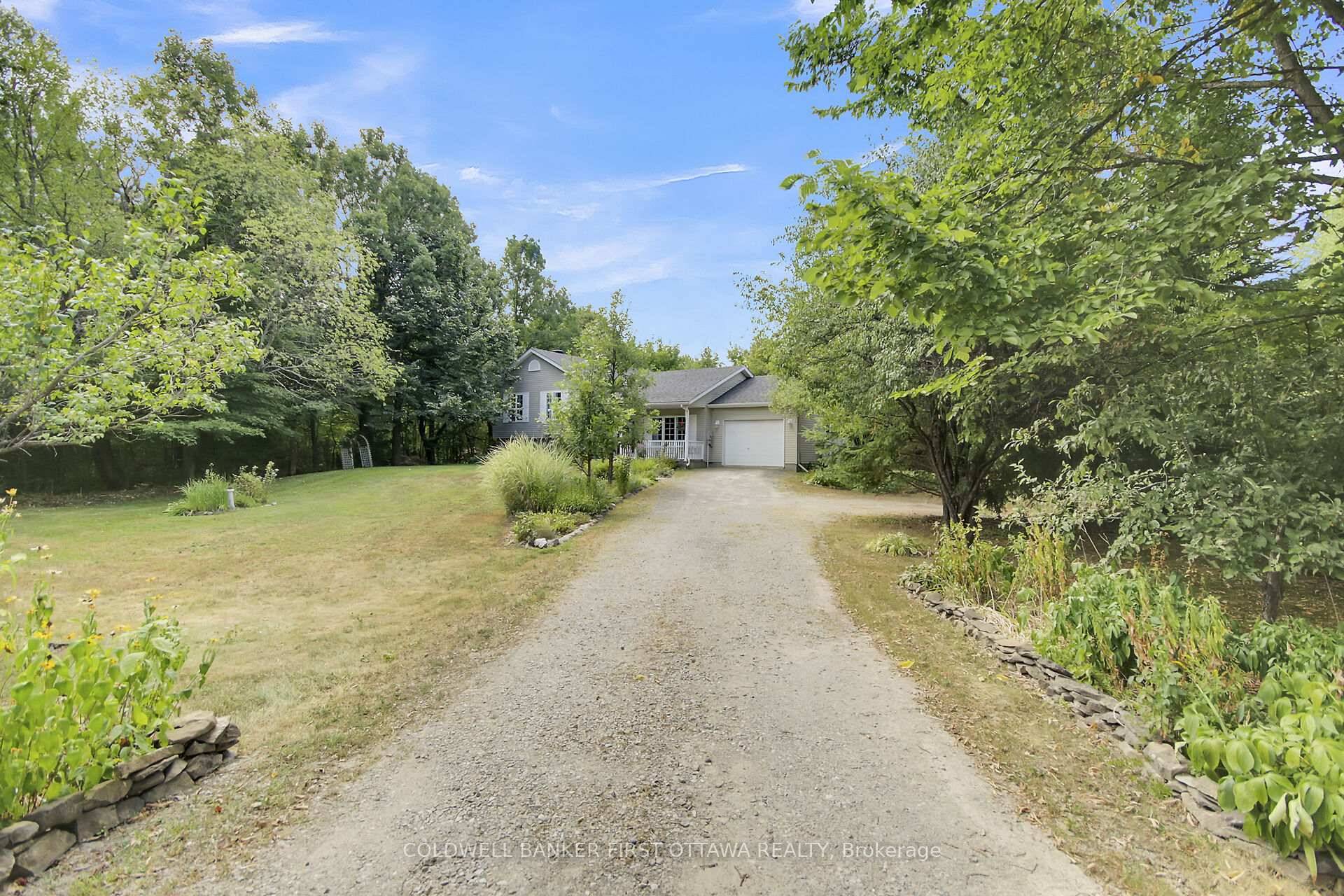 Nestled on two majestic acres, this charming country home is a haven for those seeking tranquility and space.
