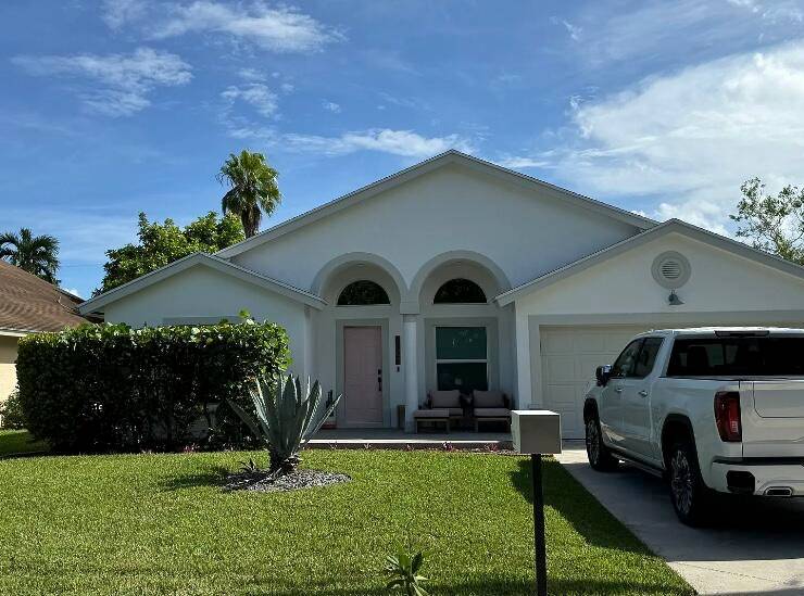 Beautifully updated 3 bed, 2 bath home is nestled on a quiet street in desirable Heights of Jupiter, overlooking Egret Landing.
