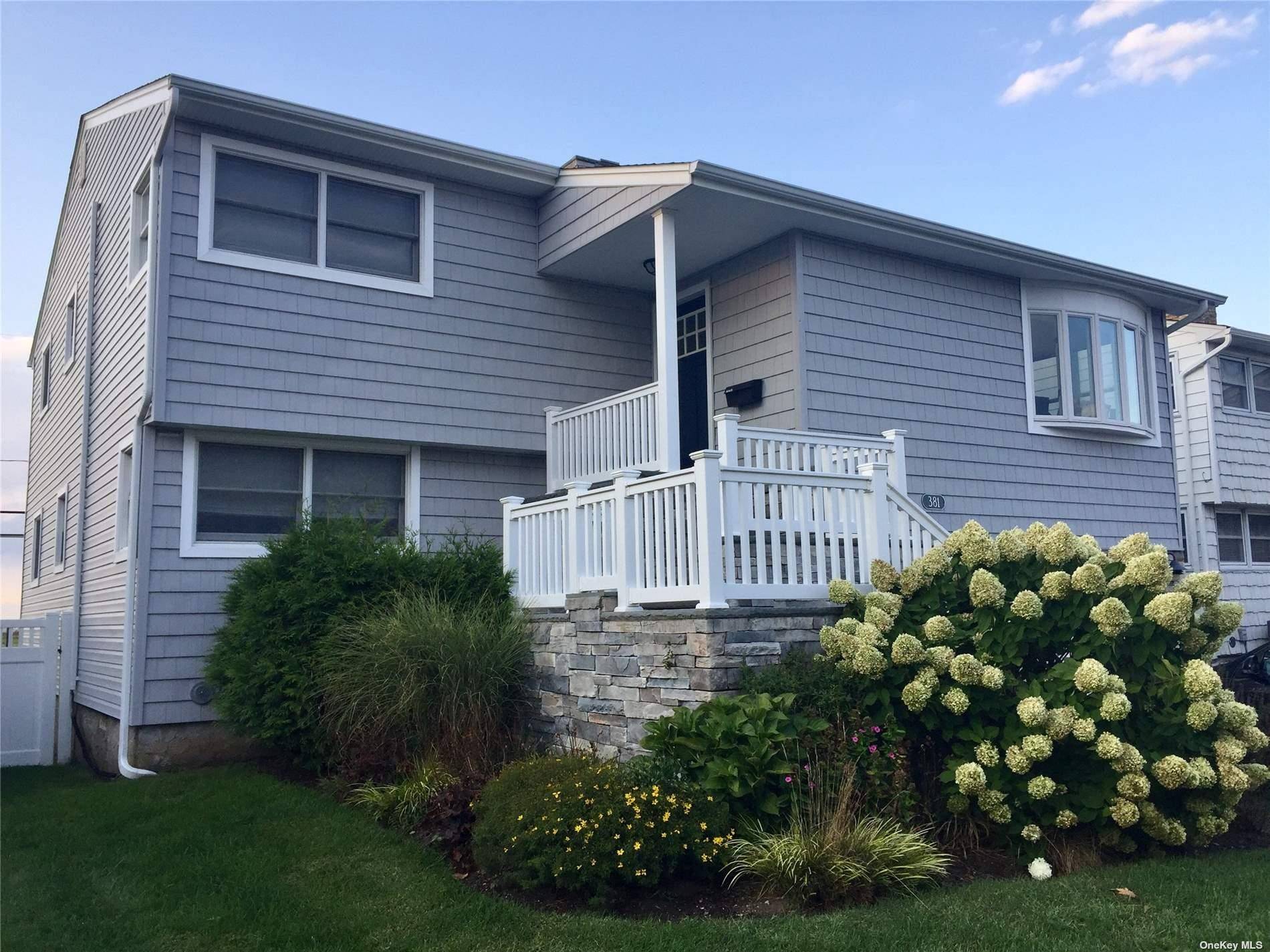 Scenic Views of Golf Course and Bay from large top floor deck, directly off Spacious Kitchen.