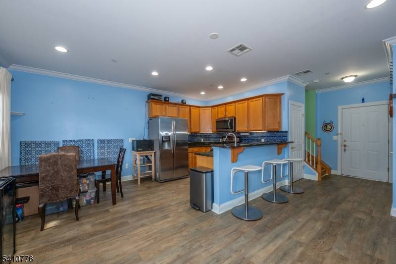 Welcome to one of Bayonne's most impeccably maintained condominiums, proudly offered by its original owner who has cared for every detail with exceptional pride.