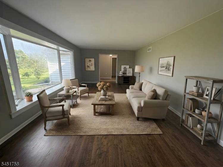 Nestled between green acres rolling fields of farm land, this spacious charming ranch offers incredible views, unparalleled privacy amply outdoor space.