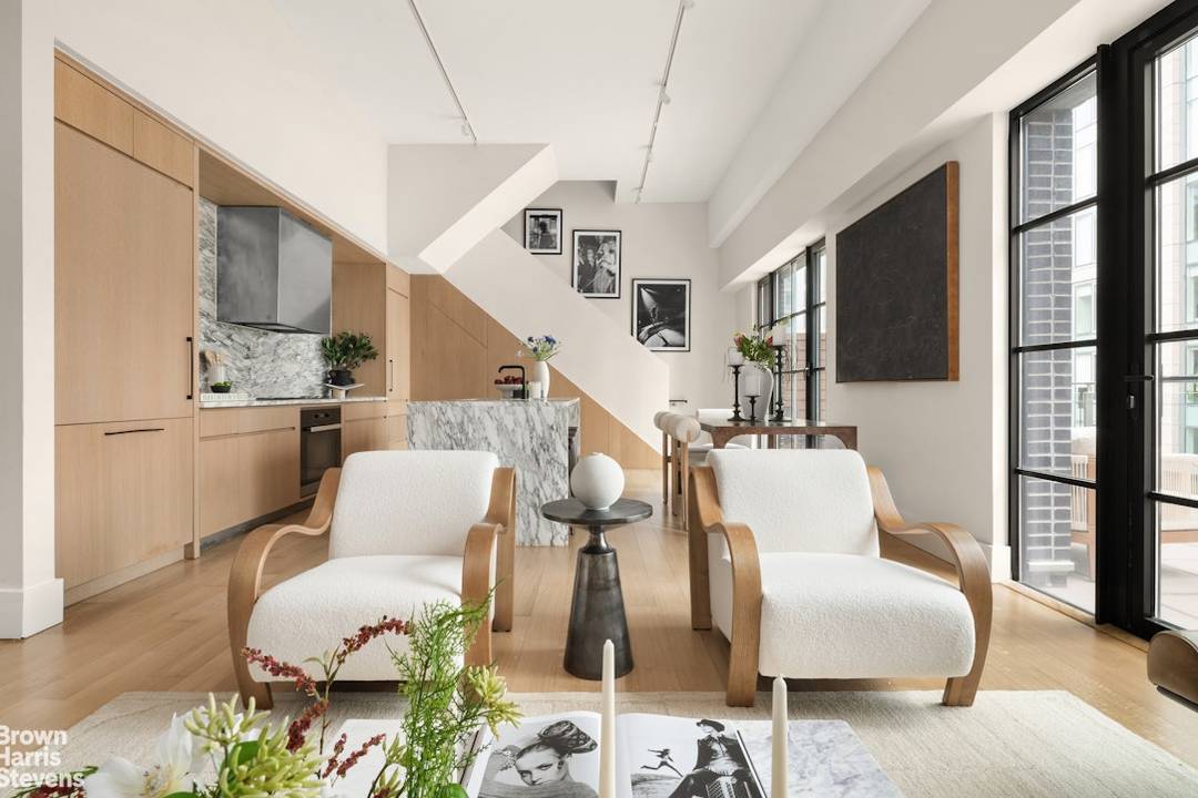 The Penthouse at 517 West 29th Street offers a rare combination of scale, design, and outdoor living, unfolding across a beautifully composed two bedroom, two bathroom duplex.