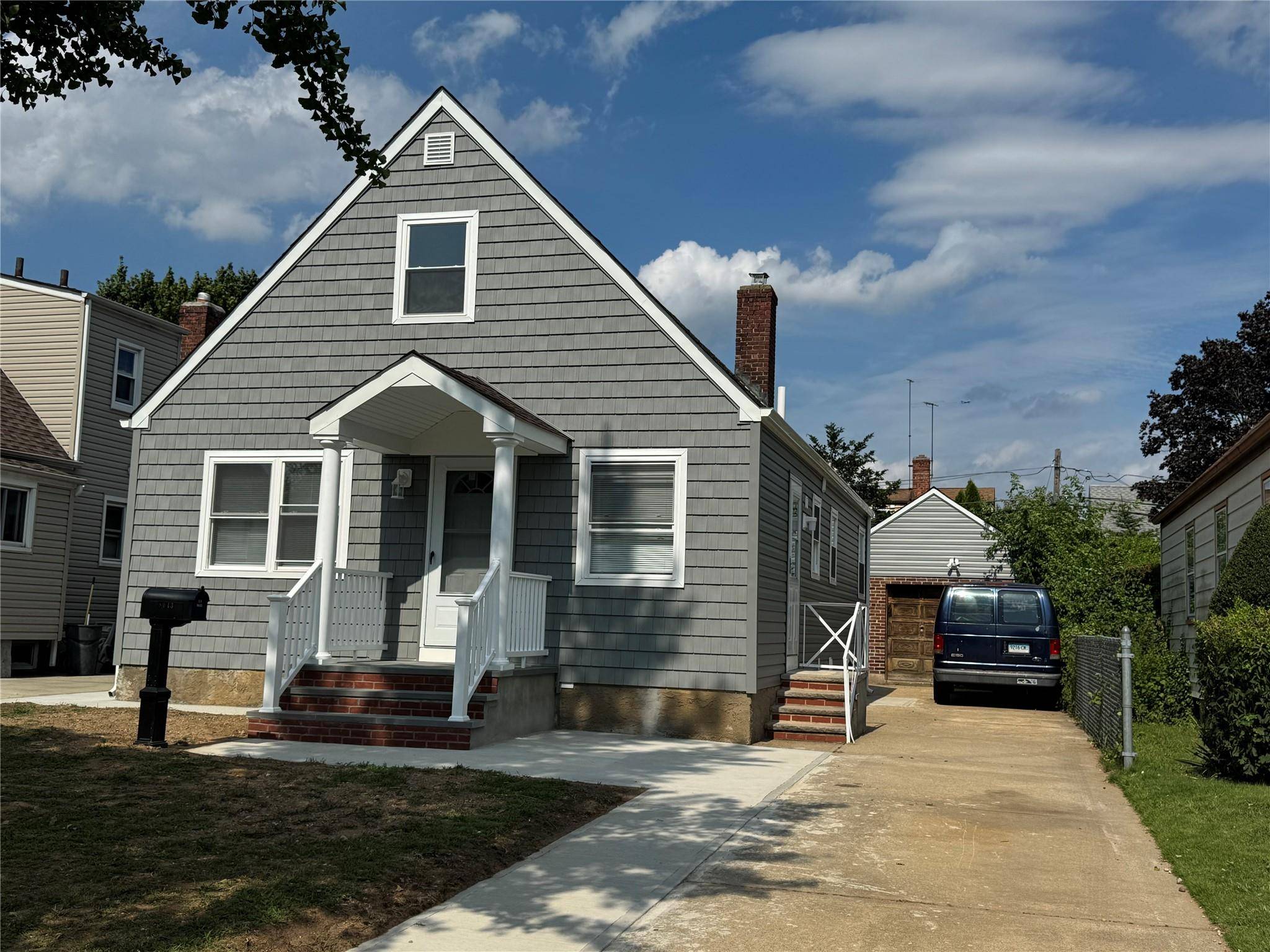 This beautifully renovated Cape style home features three spacious bedrooms and gleaming hardwood floors throughout.