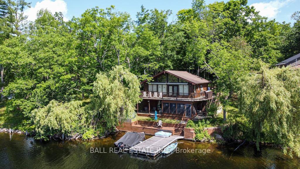 Stoney Lake Shangri La. Excellent weed free frontage with four season home cottage all on southern exposure.