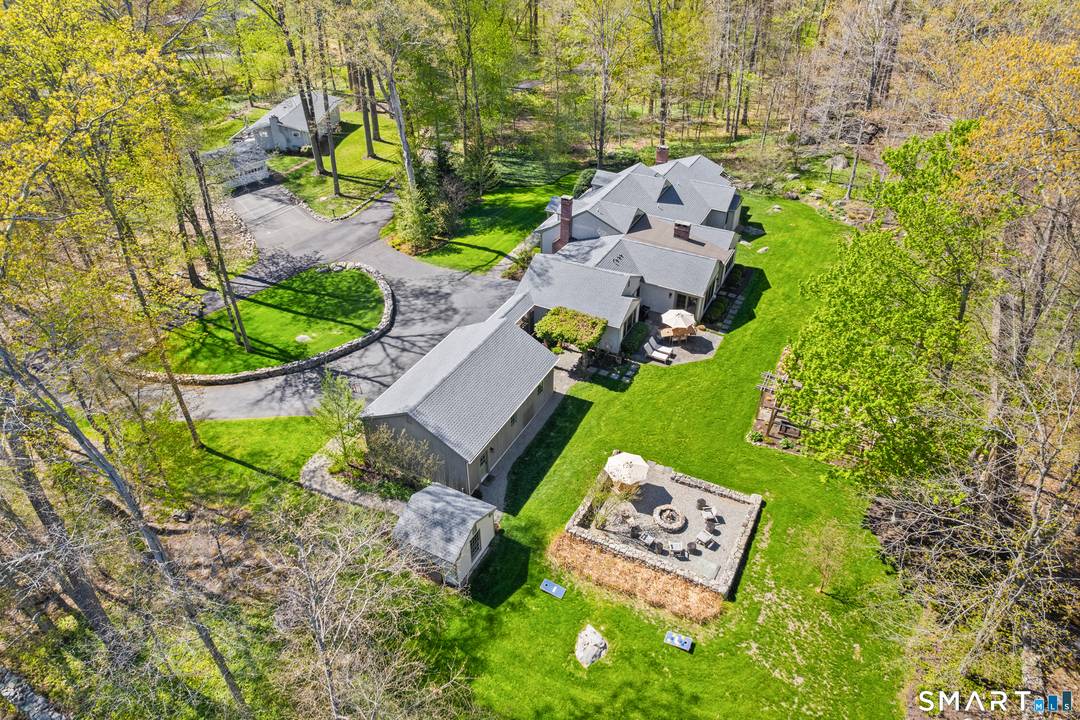 Tucked within a charming private enclave in Wilton, this architect designed retreat by Rob Sanders offers a welcome sense of calm, privacy, and everyday escape.
