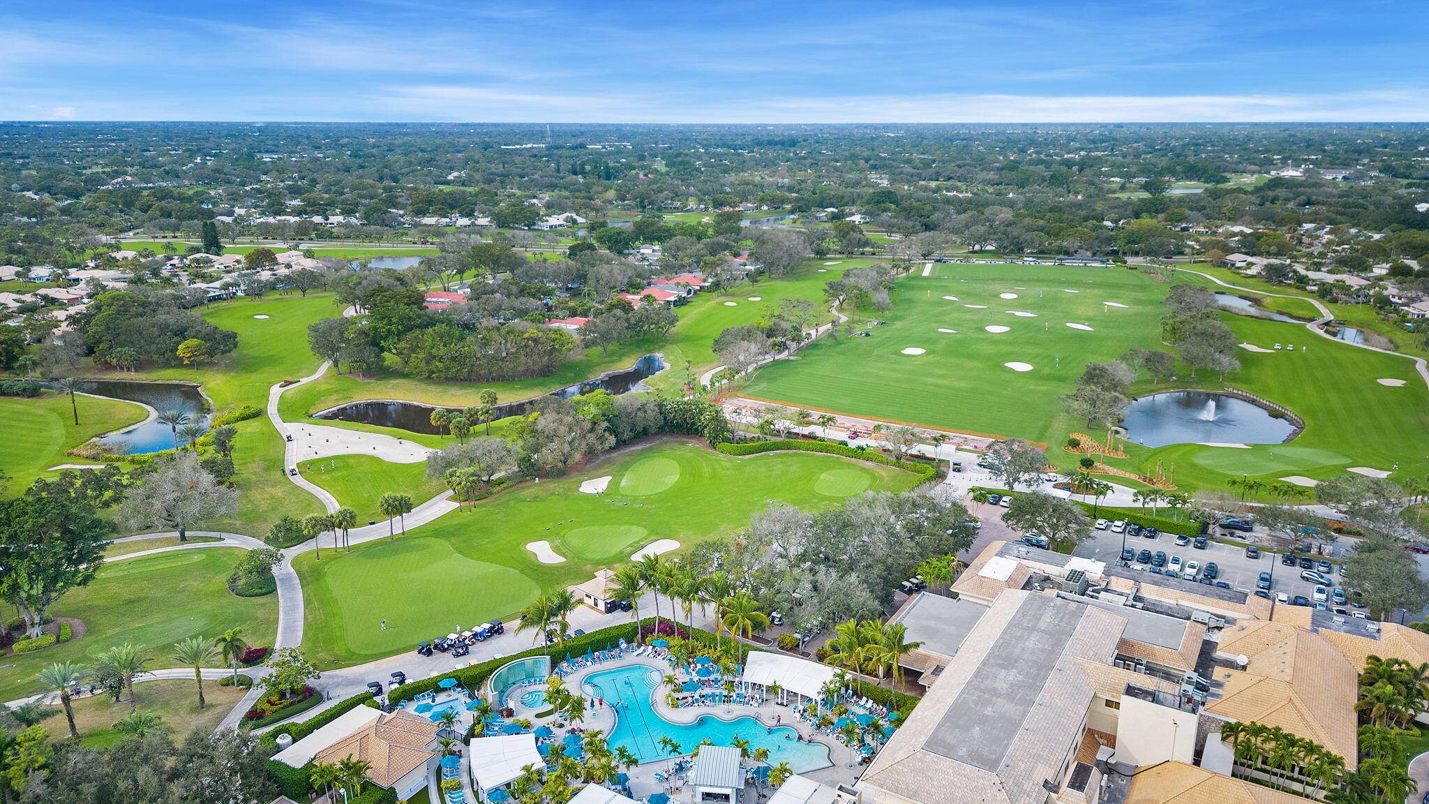 Experience elegance in this first floor, two bedroom condo with tranquil garden views at the prestigious Hunters Run Country Club.