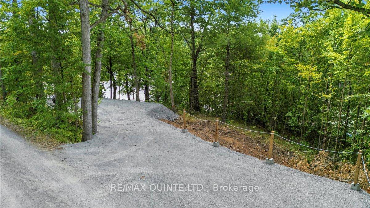 Welcome to 102 Attwood Lane a peaceful, private 1 acre waterfront lot on quiet Bucks Bay, part of the highly sought after Bobs Lake.