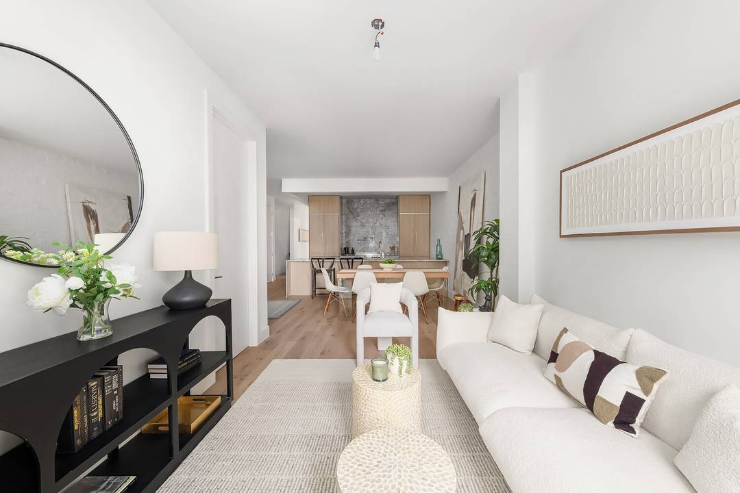 CC 595. 75 Tax 592. 61 A contemporary yet classic new gem is available in a brick facade townhouse on a serene, tree lined block with private back yard !