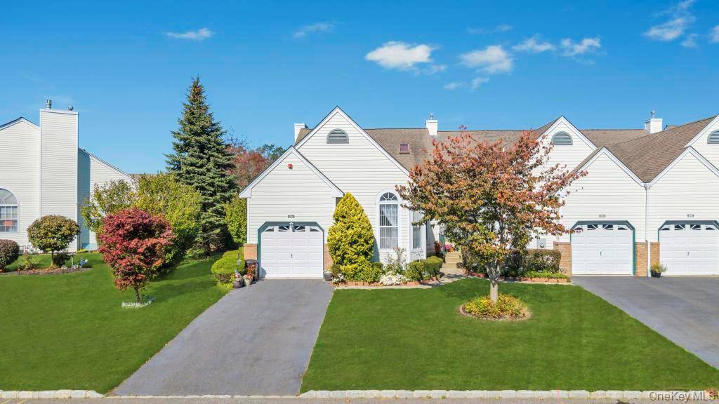 Welcome to 204 Caroline Court in Port Jefferson Station.