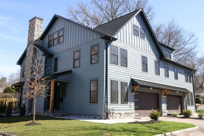 Welcome to Central Villas, a refined end unit townhome in the heart of New Providence, a seamless blend of modern design effortless living.