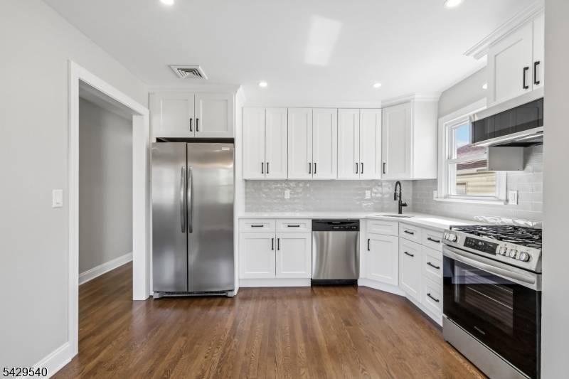 Thoughtfully updated 2 family home in one of Maplewood's most convenient neighborhoods.