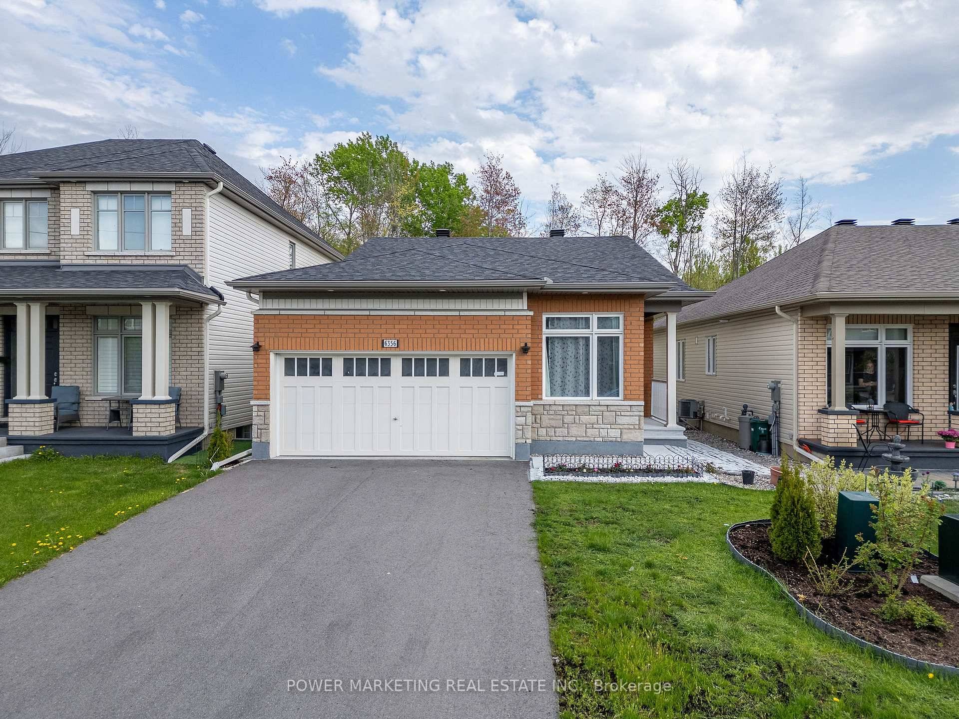Newer double car garage, bungalow for sale in Orleans.